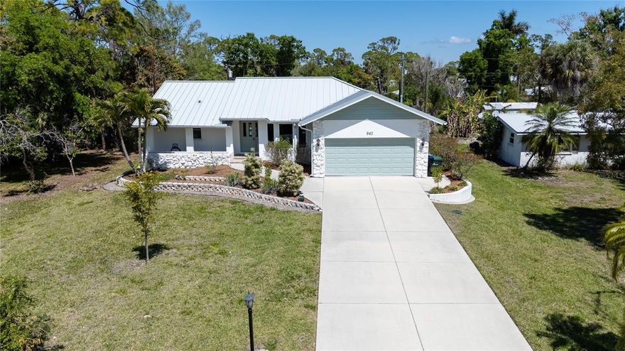 MUST SEE HOME, if you want to sit on a hill 100 feet from Lemon Bay Park in a totally remodeled 3/2/2 pool home.  This spectacular home is walking distance to Historic Dearborn Street and you can hear the waves on Manasota beach most nights.  Features include a metal roof, impact windows, a designer kitchen, high end flooring and window treatments and a large refinished pool with garden view through invisible screens.  The landscaping is established and part of Lemon Bay Parks wildlife corridor so you never know what may run through your back yard on a quite evening.  There is a buried propane tank for the water heater and firepit so add your gas range and generator anytime.  The home offers a fantastic Old Englewood location with all of the amenities you would expect in a new high end home.  This area is non deed restricted and there are no HOA or CDD fees.  The home is being offered furnished so pack your bags and call today for your private showing.