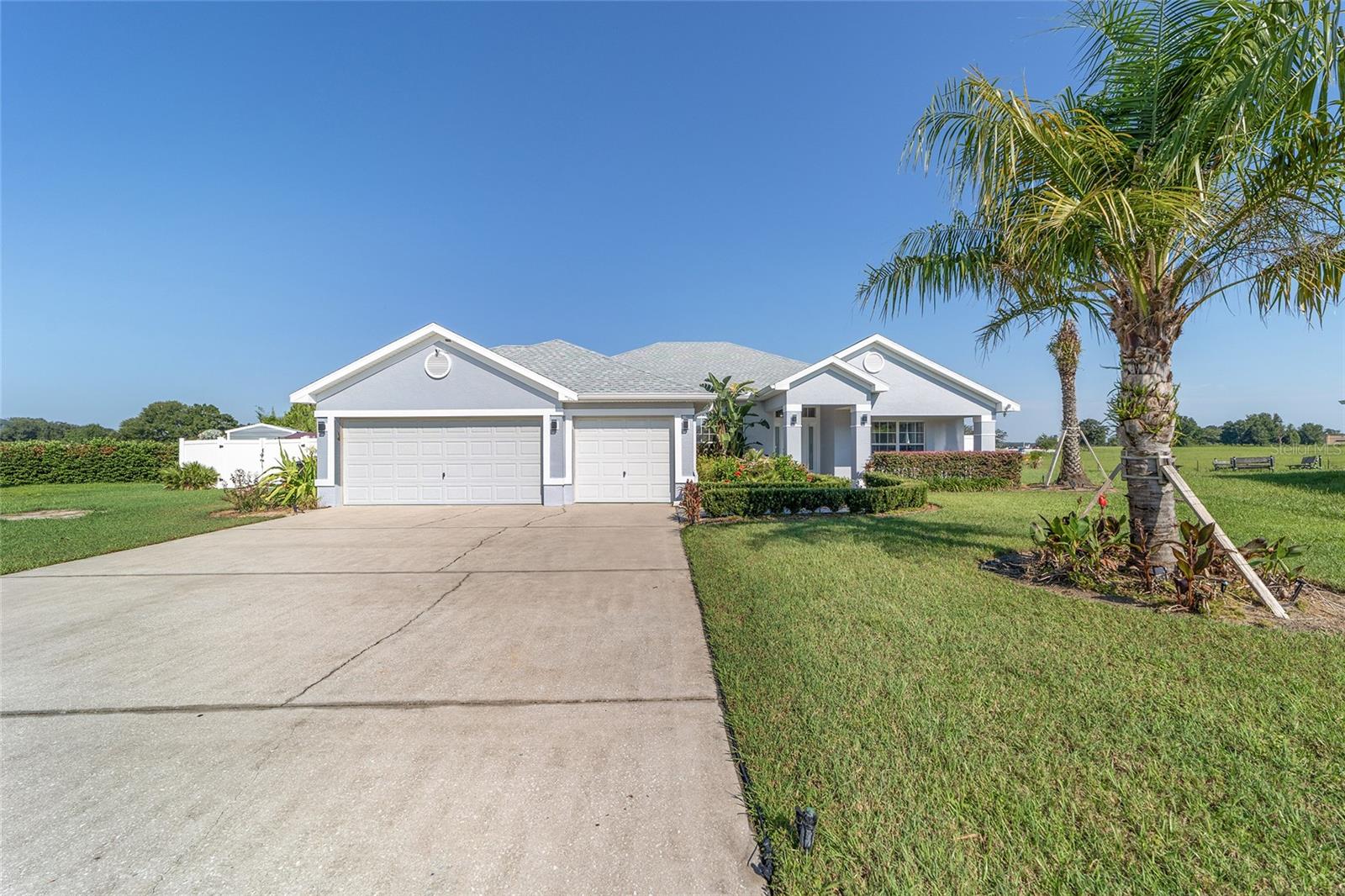 Welcome to this Immaculate 4-Bedroom, 3-Bath Home with a Den, located in the Desirable Gated Community of Meadow Glenn in SW Ocala. Tucked away on a Quiet Cul-De-Sac and set on an Oversized 0.38-Acre Lot, this property offers both privacy and space.
After walking through the Welcoming Front Porch, you will step inside to an Open Floor Plan with a freshly renovated interior. Updates include New Exterior Paint, a BRAND NEW ROOF (2025), New Water Heater (2025), Newer AC (2017), Luxury Vinyl Plank Flooring in the main living areas, New Carpet in bedrooms, Updated Kitchen, Modern Fixtures, and Stylish Ceiling Fans throughout. A Whole-House Water Filtration and Softener System (2024) adds even more value.
The Spacious Primary Suite features private lanai access, dual walk-in closets, dual vanities, a walk-in shower, and a soaking tub. The additional bedrooms and baths are thoughtfully designed for comfort and functionality. The 3rd Bathroom offers access to the lanai. The Den is perfect for a Home Office or Flex Space. Enjoy Florida living outdoors with a Screened Lanai, a Paved Patio for grilling and outdoor entertaining, and a Large Vinyl-Fenced Backyard with a Double Gate—perfect for storing a boat. An 8x16 Shed provides additional storage. The Long Driveway and 3-Car Garage ensure plenty of parking and space for storage or a workshop. Other highlights include a Laundry Room with Built-In Shelving, and a Low HOA. Meadow Glenn offers an unbeatable location with easy access to shopping (Publix just minutes away), dining, schools, and medical facilities. 45 min commute to Gainesville and 1 hr 30 min to Orlando. Schedule Your Private Showing Today!