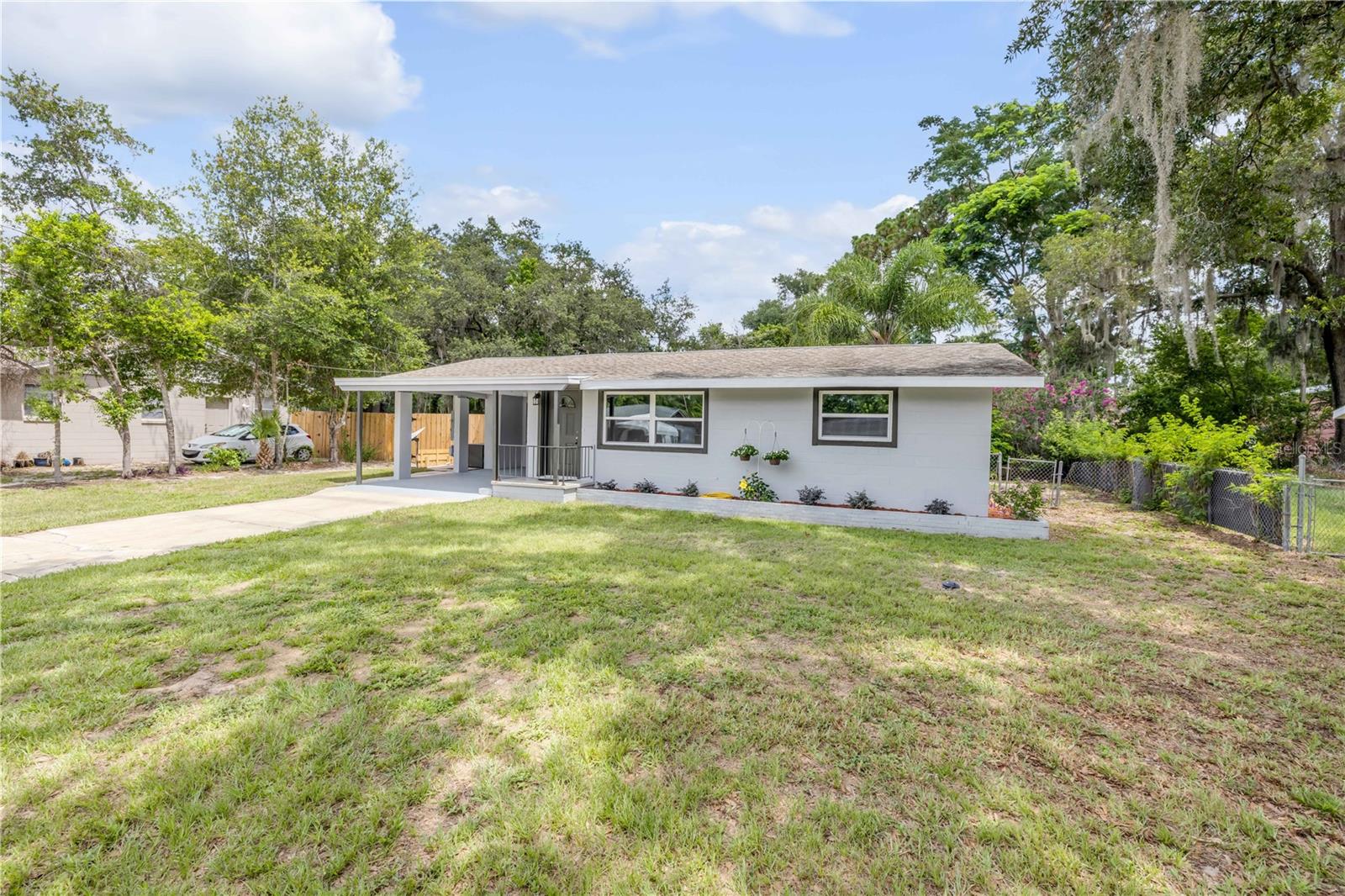 Completely renovated 3 bedroom home in a well-kept and convenient Orange City location only minutes to I-4, the Orlando Metro Area, and the beaches. Upgrades and extras include new laminate flooring, completely renovated kitchen with new cabinets, new countertops, and new stainless steel appliances. The bathroom has also been completely remodeled with new fixtures, and vanity. Also included are new energy efficient windows throughout, four new ceiling fans, a 13x13 detached block workshop, a spacious fenced backyard, and freshly painted inside and out. This beautiful remodeled home is in move-in ready condition!