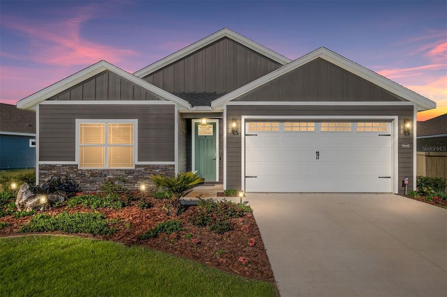 One of the most upgraded homes on the largest lot in Grand Oaks—located just 3 miles to the University of Florida and UF Health Shands. Situated in Grand Oaks Gainesville, this 2022-built William Weseman Construction Boulder floor plan offers 3 bedrooms, 2.5 bathrooms, and 1,720 square feet with a level of customization, functionality, and outdoor living that is rarely available in this community.T his property is fully finished, thoughtfully upgraded, and move-in ready, with features already completed that buyers often spend months—and significant additional cost—trying to replicate. From the moment you enter, the home feels open and refined with 9-foot ceilings, tray ceiling details, natural light, and durable luxury vinyl plank flooring throughout (no carpet). The open concept kitchen and living space is designed for connection and entertaining, anchored by a large quartz island, farmhouse sink, gas range, and custom dining room built-ins that add both character and function. The primary suite goes beyond a standard layout, offering a built-in office nook with floating desk and recessed electronics media panel with outlet for wall mounted TV, along with an upgraded walk-in closet system designed for organization and ease. The bathroom continues the elevated feel with a glass-enclosed tiled shower with premium soft-close shower door and added comfort features. What truly sets this home apart is how it lives beyond the walls. Step outside to one of the largest, fully fenced yards in Grand Oaks, already transformed into a functional and inviting outdoor space. Whether it’s gardening, relaxing, or simply enjoying the space, the yard includes raised vegetable beds with drip lines and full irrigation, curated garden areas, herb plantings, and a container water feature, along with a separate enclosed side yard with river rock ground cover and auto-water trough currently used as a dog run. This is the kind of outdoor setup buyers envision—but rarely find already completed. For those who value workspace, hobbies, or organization, the garage has been fully upgraded into a true working environment with custom workbench, built-in power access, overhead storage, tool organization systems, and wall-mounted storage solutions—a standout feature that sets this home apart from others in the neighborhood. Smart home features such as an Ecobee thermostat, Ring security system, smart lighting, and video doorbell add another layer of convenience and modern living.
Located just minutes from UF, UF Health Shands, Butler Plaza, Celebration Pointe, and major Gainesville roadways, this home offers the ability to stay connected to everything while enjoying a space that feels complete, personal, and ready to enjoy from day one. 
For buyers comparing new construction  or other completed homes in Grand Oaks, this home represents something different—a finished, upgraded, and functional home on a premium lot where the work has already been done.