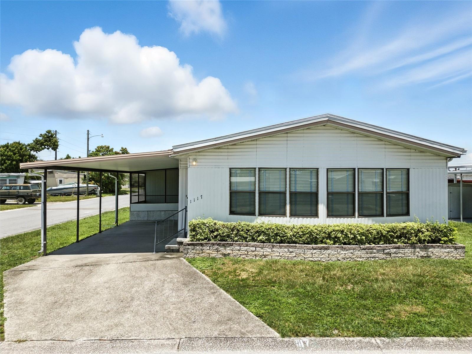 Welcome to Your Sunny Slice of Paradise in Fair Lane Acres! This spacious 2-bedroom, 2-bathroom DOUBLE WIDE is the perfect paradise, tucked away in the charming, active 55+ community of Fair Lane Acres! LAND OWNED and offering the ideal blend of comfort, convenience, and coastal lifestyle—all at an INCREDIBLE AFFORDABLE VALUE! BRAND NEW WATER HEATER! Step inside and feel instantly at home in the light-filled living area, where oversized windows invite the Florida sunshine to pour in. After a lifetime of hard work, it is YOUR TIME to soak in the SUNSHINE! The open-concept design offers an easy flow from the living room to the dining area and kitchen—perfect for everyday living and casual entertaining. Each bedroom offers generous WALK-IN CLOSET space, and the two full baths ensure privacy and ease for guests or live-in loved ones. Outside, step in to your generously oversized SCREENED-IN LINAI, the perfect space for cards with friends, or to enjoy the immaculate Florida sunsets. Enjoy your covered carport, ideal for shielding your vehicle from the Florida sun, plus an extra storage shed with washer and dryer hookups, to house tools, beach chairs, or holiday decorations—because we know you’ll be making the most of every season here! But the real magic? Location, location, location! You're just 20 minutes to the world-famous GULF BEACHES where TURQUOISE waves and white POWERDY sands await. SRQ Airport, Manatee Memorial, Sarasota Memorial Hospital, and hundreds of shops and restaurants are all within easy reach—making everyday errands or spontaneous outings an absolute breeze. And with a low HOA with LAND OWNED, you’ll enjoy all the perks of living without the high fees. Whether you’re looking to settle into your forever home or invest in your next warm-weather escape, this one checks all the boxes. Fair Lane Acres offers a welcoming, pet-friendly vibe, community pool and clubhouse, fitness center, and friendly neighbors who just might become lifelong friends. Don’t wait to live the Florida lifestyle you’ve dreamed of—this gem won’t last long! Call today to schedule your private showing!