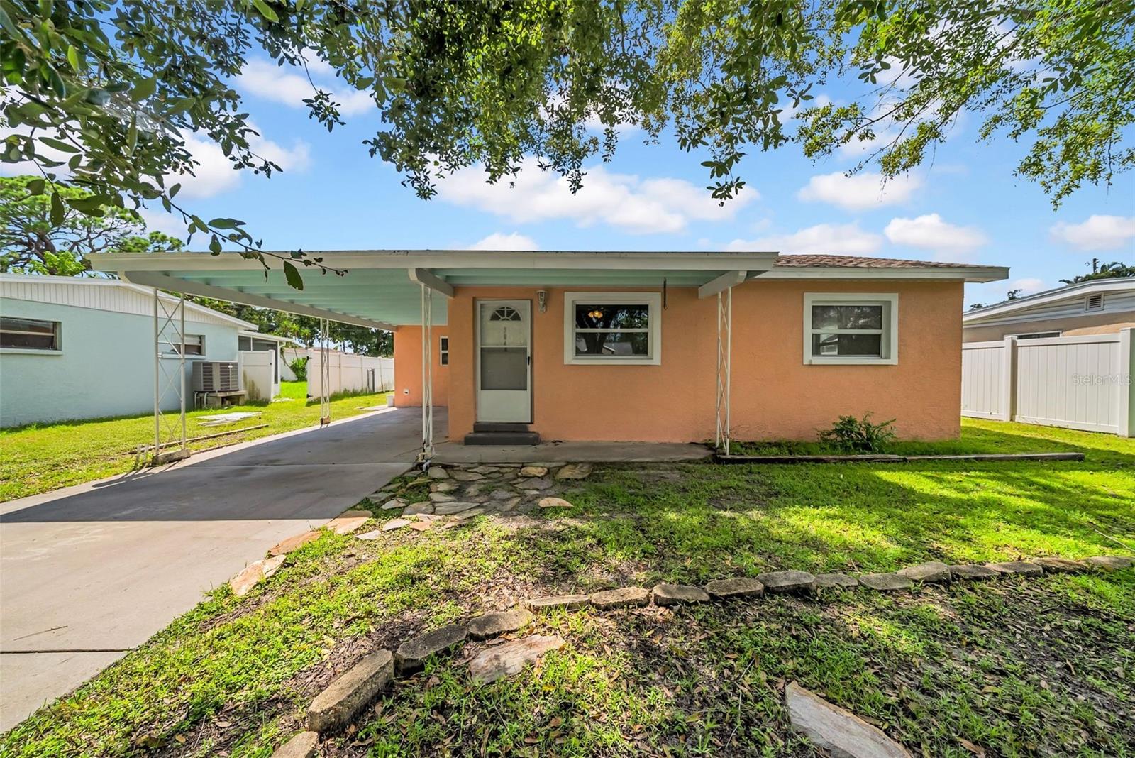 This bright and comfortable one-bedroom, one-bathroom home is your invitation to experience the best of life in St. Petersburg. Located in the friendly Riviera Bay neighborhood, it’s just minutes from scenic preserves, local parks, waterfront spots, and some of the area’s best shopping and amenities.
Inside, natural light fills a spacious living room that flows into a brand-new kitchen with stainless steel appliances, clean modern finishes, and everything you need to make cooking feel effortless. The adjacent dining area offers flexibility to fit your lifestyle, whether it’s for daily meals, remote work, or creative use. A large bonus room off the dining area provides extra space for storage, hobbies, or a personalized setup.
The home also includes a washer and dryer for everyday convenience, a brand-new bathroom, and a new HVAC system for year-round comfort. The primary suite is generously sized, featuring a large bedroom and a designer walk-in closet that even a princess would appreciate. The attached bathroom offers a second entrance from the main living area for both privacy and functionality.
Out back, the fully fenced yard is one of the home’s standout features. With vibrant, healthy grass, lawn care included by the owner, it’s perfect for barbecues, gardening, pets, or simply enjoying the Florida sun. A covered carport in front keeps your vehicle shaded and protected while making daily life more convenient.
For those who love being on the water, the Sunlit Cove boat ramp is just 0.3 miles away, offering quick access to boating, paddle boarding, or peaceful sunset rides. Just as close is the Gateway Market Center, where you’ll find Target, TJ Maxx, grocery stores, and other essential shops that make errands easy and last-minute runs stress free. Riviera Bay offers a true neighborhood feel while still being incredibly central. Its proximity to the Gandy Bridge puts you minutes from downtown St. Petersburg, South Tampa, and the airport, while Weedon Island Preserve is nearby for nature walks, kayaking, and fresh air.
Whether you’re staying in or heading out, everything is close and easy. This home blends fresh updates, flexible living, and the convenience of the St. Pete lifestyle.