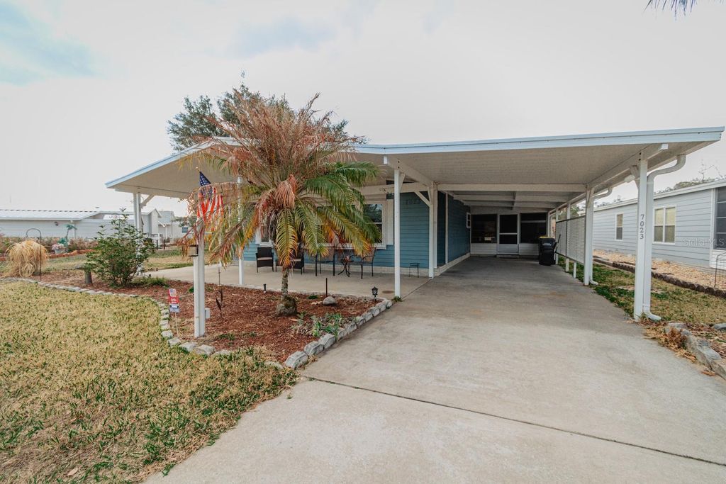 Photo of 7023 Tamarind Drive, Lake Wales, FL 33898 (MLS # TB8480014)