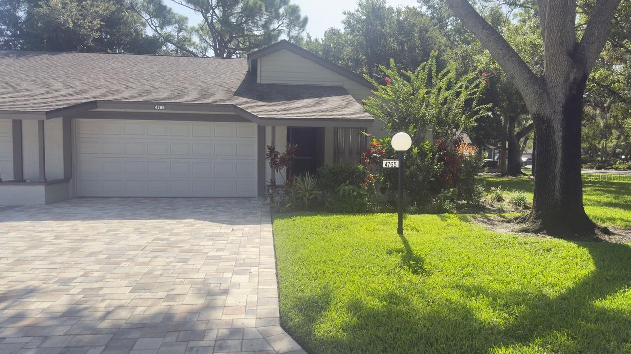 Welcome to this beautifully maintained 2-bedroom, 2-bath home located in desirable Oak Forest Villas, a quiet canopy-treed neighborhood. The open concept layout offers a spacious floor plan featuring volume ceilings and skylights that fill the living space with natural light.
The living and dining areas flow seamlessly, creating a comfortable space for relaxing or entertaining. The kitchen boasts solid wood cabinets, solid surface countertops, combined with a large dining room, perfect for family dinners. Enjoy serene views of mature landscaping and tranquil oak trees from the expansive Florida room—a peaceful retreat for reading, unwinding, or entertaining guests.
Built with sturdy block construction, this villa also features a 2-car attached garage, providing convenience and extra storage.
You'll love the maintenance-free lifestyle! Oak Forest has undergone many upgrades in recent years (all new pavers in driveways and front porches, new roofs, exterior painting, heated pool & tennis / pickleball court / clubhouse upgrades). Pet-friendly and convenient to the walking trails of Red Bug Nature Preserve & Legacy Trail. Short drive to Siesta Key Beach and downtown Sarasota for fine dining, live music, art galleries, and shopping. Sarasota has something for everyone of all ages!