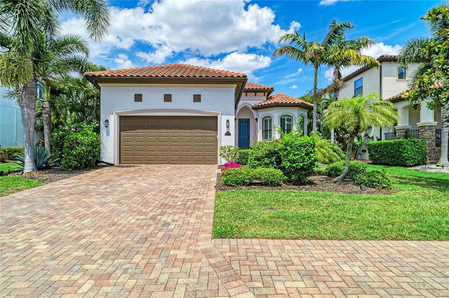 Beautifully upgraded home in the desirable gated Legends Bay enclave. Situated in a prime location nestled along the Sarasota Bay. This energy-efficient home is storm ready and offers quality construction including impact windows and sliding glass doors. Lush landscaping welcomes you into a sunlit and cheerful residence with premium upgrades. The kitchen features double stacked cabinets, a natural gas range with vented hood, natural granite countertops and classic stainless appliances. Additional upgrades include easy-maintenance luxury vinyl plank wood flooring, fresh designer paint, upgraded lighting & fixtures, and smart mirrors in primary bedroom. Pre-plumbed for an outdoor kitchen and generator. This split floorplan offers open gathering spaces, the privacy of split bedrooms, and the convenience of a flexible den or office space. 

The large covered lanai overlooks a private backyard with plenty of room for a pool. The oversized two-and-a-half-car garage offers extra storage. Golf cart accessible to IMG. Residents enjoy a community pool, private fishing pier, and easy access to Anna Maria Island and downtown Sarasota.