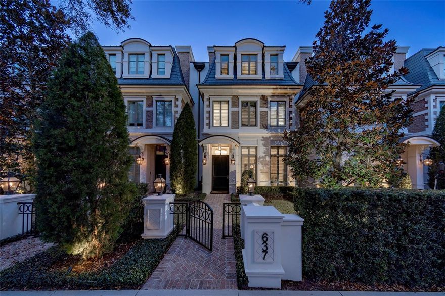 A timeless brownstone in the exclusive Park Hill provides a lifestyle that is unparalleled. Enjoy world-class restaurants, shopping, events and museums within a short walk, and are the only brownstones on Park Avenue to have this highly sought-after, exclusive location. An inviting front courtyard welcomes you with a brick walkway to a covered entrance flanked by stately gas lanterns. This three-story home with an elevator features three en-suite bedrooms with three full and two-half baths, offering generous open living, dining and kitchen spaces that overlook a private courtyard complete with a summer kitchen. Large windows throughout the home seamlessly bring the outside in and allow natural light to gently roll in. The gathering space showcases an incredible built-in focal point with sliding doors detailed with a subtle starburst and an antique mirror backdrop, allowing art to be displayed or the doors to be opened to relax and enjoy your favorite show. Expansive 10-foot ceilings, extensive millwork and moldings throughout, gorgeous hardwood floors, upgraded designer-selected fixtures and hardware, additional lighted glass built-ins and French doors add to the architectural detail for an elevated living experience. A chef’s kitchen surrounds a center island, blending into the dining and living spaces for ease of entertainment. Wolf and Sub-Zero appliances, gorgeous light cabinetry, a pop of color on the island with bar seating, marble details, an incredible walk-in pantry and a wet bar/butler's nook deliver great function for intimate gatherings. A two-car air-conditioned garage with loads of storage, an organization system and additional ceiling storage round out the first-floor offerings. The second floor continues with upscale appointments, featuring a flex space with built-ins and a wet bar with an under-counter refrigerator that opens to an outside covered balcony. Also on this floor is a laundry room, loft area and two large bedrooms, each with a walk-in closet and its own bath. The third floor, the primary bedroom showcases an upholstered bed wall, three dormers overlooking Park Avenue, storage window benches with room to relax in a tranquil setting and a luxurious primary bath with floor-to-ceiling windows, dual vanities with high-quality materials and finishes, a large glass-enclosed shower and soaking tub. Two large walk-in closets with closet systems feature a makeup vanity with marble countertop, mirrored backsplash and hardwood floors with beautiful light to elevate the experience. A gracious morning/evening station with a Sub-Zero under-counter refrigerator and stylish backsplash opens to a private rooftop terrace with a fireplace, wet bar and TV, plus a half bath to enjoy evening sunsets and Florida breezes. Every detail has been accounted for in this Park Avenue property, offered fully furnished with designer selections throughout. Other details include Old Carolina brick, three-story block construction, soundproof hollow core floors, precast exterior trim and a slate mansard roof. There are five air conditioning units, three tankless gas water heaters and the property has been meticulously cared for.