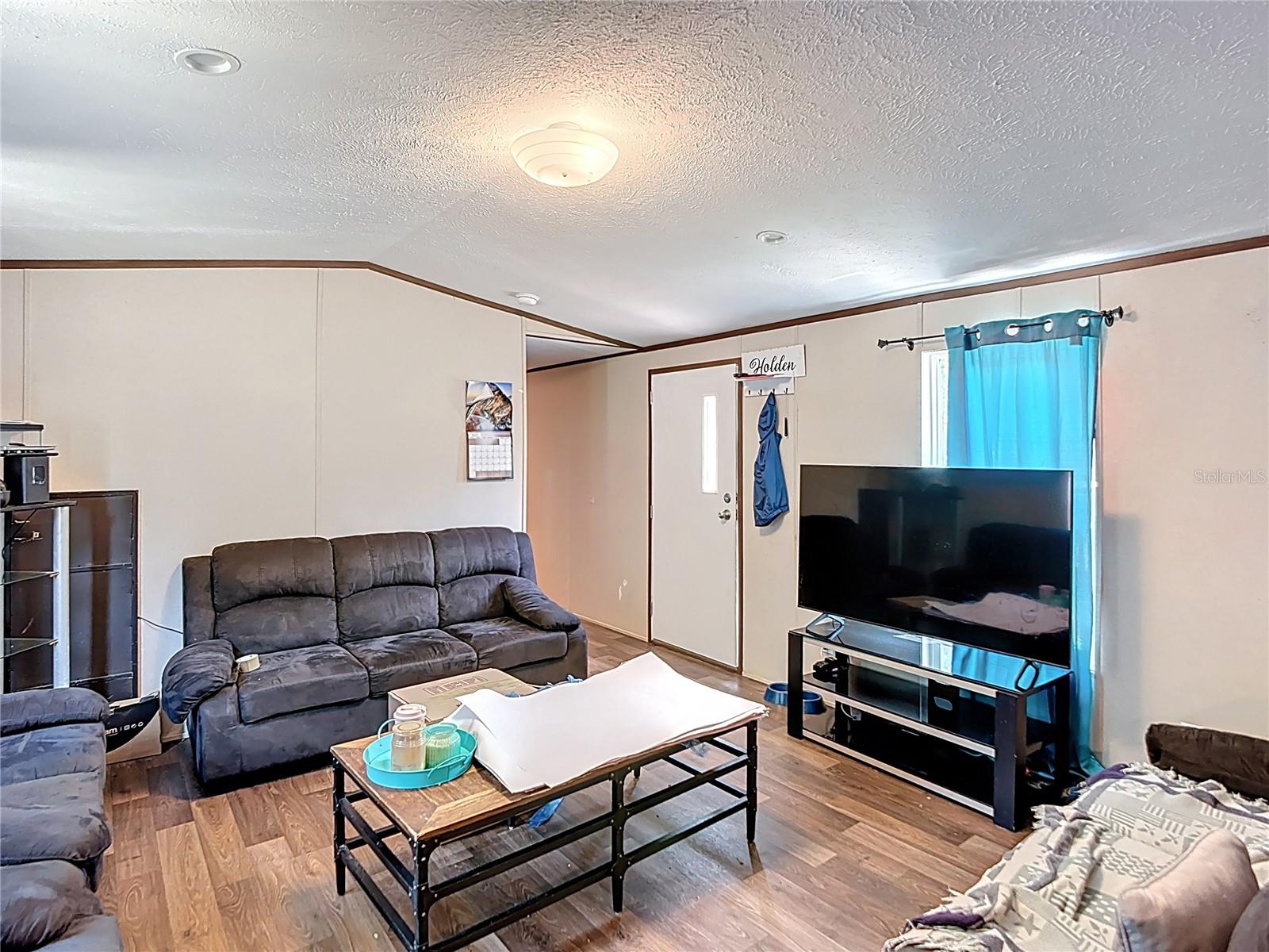Welcome to this beautiful 2024 mobile home located in the heart of Keystone Heights. This spacious 4-bedroom, 2-bath residence features a desirable split floor plan with brand-new luxury vinyl plank (LVP) flooring throughout. The open-concept layout offers a large living area and kitchen, perfect for family gatherings or entertaining guests. One of the bedrooms is ideal for a home office, playroom, or flex space. Enjoy a generously sized backyard with an above-ground pool—great for relaxing or summer fun. Situated in a quiet neighborhood with a brand-new well and septic system, this home is centrally located near shopping, schools, and popular recreation spots like Lake Geneva and other nearby lakes—perfect for fishing, kayaking, and swimming. Experience the best of peaceful country living with the convenience of nearby amenities!