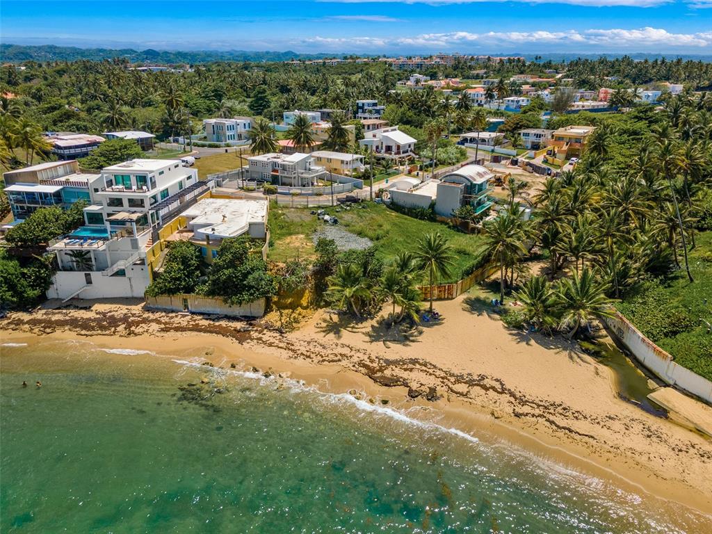 Rare oceanfront double lot in the highly sought after Breñas community. Walk directly onto your personal beach located within a protected cove that is perfect for paddleboarding, swimming, fishing and snorkeling. This property overlooks Playa Tocones - a hidden beach paradise five minutes from the Dorado Beach Ritz-Carlton Reserve - and presents a prime “build your dream home” development opportunity. This extraordinary ¼ acre (900+ sq meter) property offers an unrivaled 130 feet of beach frontage. Just imagine enjoying the sites and sounds of warm turquoise water stretching out across the Caribbean Sea in your own private paradise. This gem is situated minutes from the new hospital, restaurants, shopping, and one of the best private schools on the island.
This property has existing plans for a 4-story duplex and comes with so many opportunities for the right buyer: build a single trophy estate, two separate homes, or a multi-unit investment property. The options are limitless!