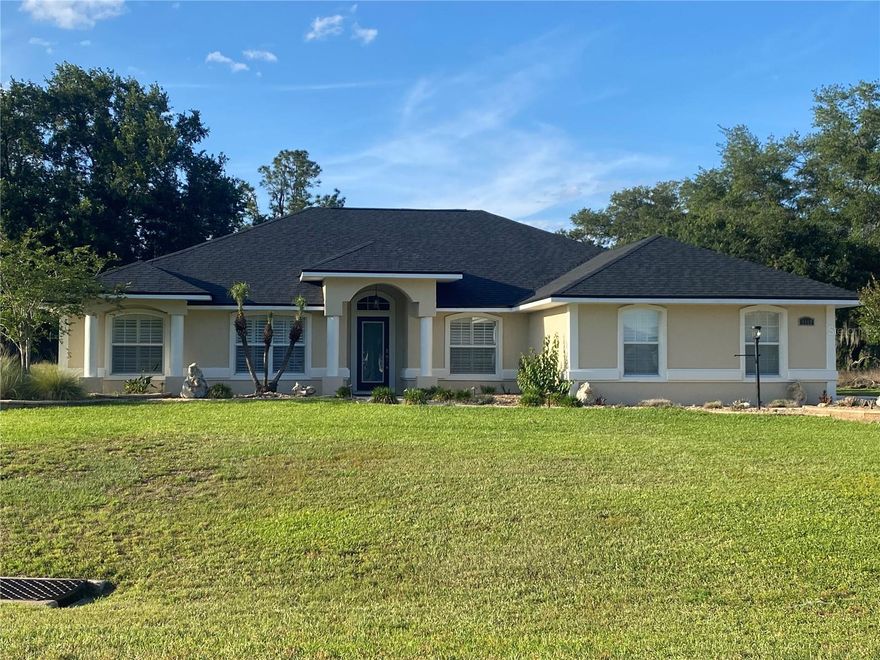 Under contract-accepting backup offers. Welcome to this beautifully maintained, move-in ready 3-bedroom, 2-bath residence with a 2-car garage and dedicated office/den, perfectly situated on a generously sized homesite where peace, privacy, and convenience come together in perfect harmony. Offering approximately 1,900 square feet of heated living space and over 2,800 total square feet, this home delivers an exceptional blend of comfort, functionality, and serene living.

From the moment you arrive, you’ll feel the calm, unhurried atmosphere that sets this property apart. With no homes currently built behind, the backyard offers a rare sense of openness and quiet—creating a tranquil retreat where you can truly unwind, whether enjoying your morning coffee as the day begins or relaxing in the soft glow of a Florida sunset.

Inside, a bright, open-concept floor plan welcomes you with soaring vaulted ceilings and an abundance of natural light, enhancing the home’s airy and peaceful feel. Elegant tile flooring flows throughout the main living areas, while all bedrooms feature luxury vinyl plank for a clean, modern touch. The spacious kitchen overlooks the living and dining areas and is equipped with stainless steel appliances, making it the perfect space to gather, entertain, or simply enjoy everyday moments in comfort.

Both bathrooms are thoughtfully designed with double vanities, and the guest bath offers convenient direct access to the screened lanai—ideal for seamless indoor-outdoor living and future pool plans.

Step out to the expansive screened lanai and experience the true highlight of this home. This private outdoor space invites you to slow down and soak in the quiet surroundings, with plenty of room to create your own personal oasis—whether that’s a pool, lush garden, or a peaceful lounge area. The absence of rear neighbors enhances the sense of seclusion, making this space feel like your own hidden retreat.

Beyond the property itself, the location is simply unmatched. Nestled in one of the most convenient areas you could ask for, you’re just minutes from shopping, dining, medical facilities, and everyday essentials—making errands effortless and life that much easier. Everything you need is right at your fingertips, yet when you return home, you’re greeted by a level of peace and tranquility that feels worlds away from it all.

Additional features such as an indoor laundry room, water system, and a 2021 HVAC replacement provide both convenience and peace of mind.

Combining privacy, thoughtful design, a serene setting, and an unbeatable location, this exceptional property offers the best of both worlds—a quiet retreat with everything you need just moments away. This is more than a home… it’s a lifestyle.