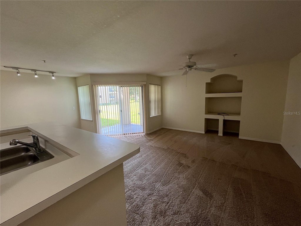 Photo of 7360 Westpointe Boulevard #116, Orlando, FL 32835 (MLS # O6453179)