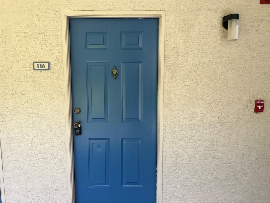 Photo of 7360 Westpointe Boulevard #116, Orlando, FL 32835 (MLS # O6453179)