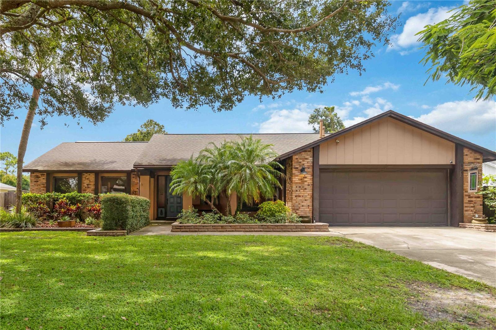 This beautifully updated, well-maintained four-bedroom, two-bathroom home offers over 2,000 square feet of living space and a fantastic outdoor area. Inside, updated laminate flooring creates a seamless look with no carpet throughout the entire home.
The flexible formal living and dining spaces can be used as a home office, a second living area, or even a fifth bedroom. The great room, with its vaulted ceilings, opens to a bright breakfast nook and a kitchen featuring granite countertops, gas range, a breakfast bar, a pantry, and plenty of cabinet space.
The primary bedroom has direct access to the screened lanai and includes a walk-in closet with built-in organizers and an updated ensuite bathroom with a dual vanity and a tiled shower. The three additional bedrooms are all spacious and share an updated, well-appointed bathroom.
The outdoor space is a true highlight, featuring an oversized 23x20 covered and screened lanai that leads to a paver patio and a large, tree-lined, fenced yard.
Located in the established Watermill Lakes community with an optional HOA, this home is in a great location with easy access to downtown, local lakes, recreational activities, UCF, schools, shopping, and dining.
Schedule a tour to see this home today!
