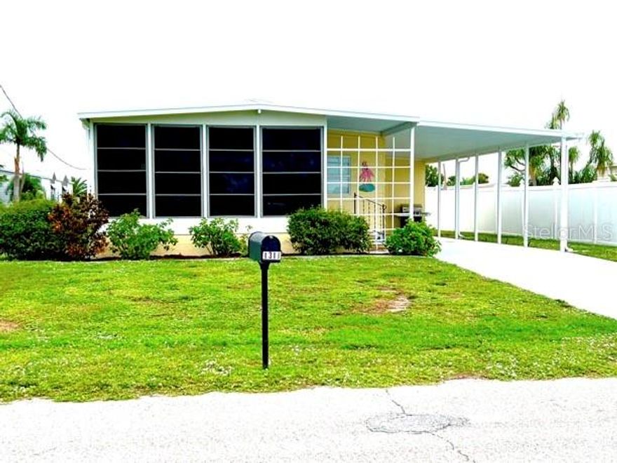 55+ community- VERY WELL MAINTAINED.. suffered VERY MINIMAL IAN DAMAGE,  OFFERS NEW CARPET, FRESH PAINT, FURNISHED, AND YOU OWN THE LOT! ON A FRESHWATER CANAL where you can fish from your yard. Just minutes to the beaches, shops, stores, and restaurants. located in a "VOLUNTARY MOBILE HOME ASSOCIATION" community. www.holiday-estates.org. ASSOCIATION ACTIVITIES INCLUDE BINGO, COUNTRY BREAKFASTS, CRAFTS, CRAFT SALES, DANCES, CARD PARTIES AND DINNERS. BOAT RAMP ACCESS INCLUDED WITH MEMBERSHIP. SECURITY PATROLLED. ROADS OWNED AND MAINTAINED BY THE COUNTY.