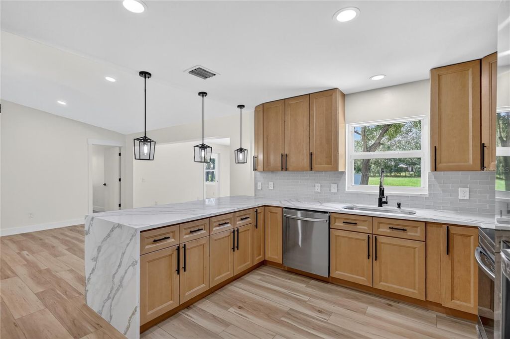 Photo of 32524 Greenwood Loop, Wesley Chapel, FL 33545 (MLS # TB8412963)