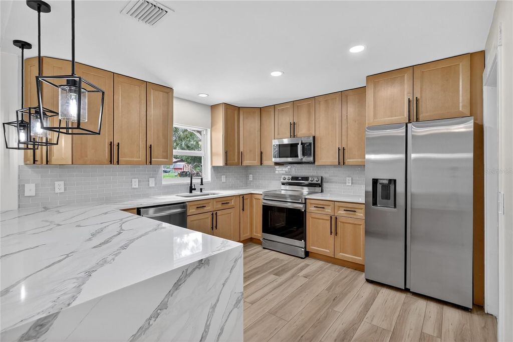 Photo of 32524 Greenwood Loop, Wesley Chapel, FL 33545 (MLS # TB8412963)