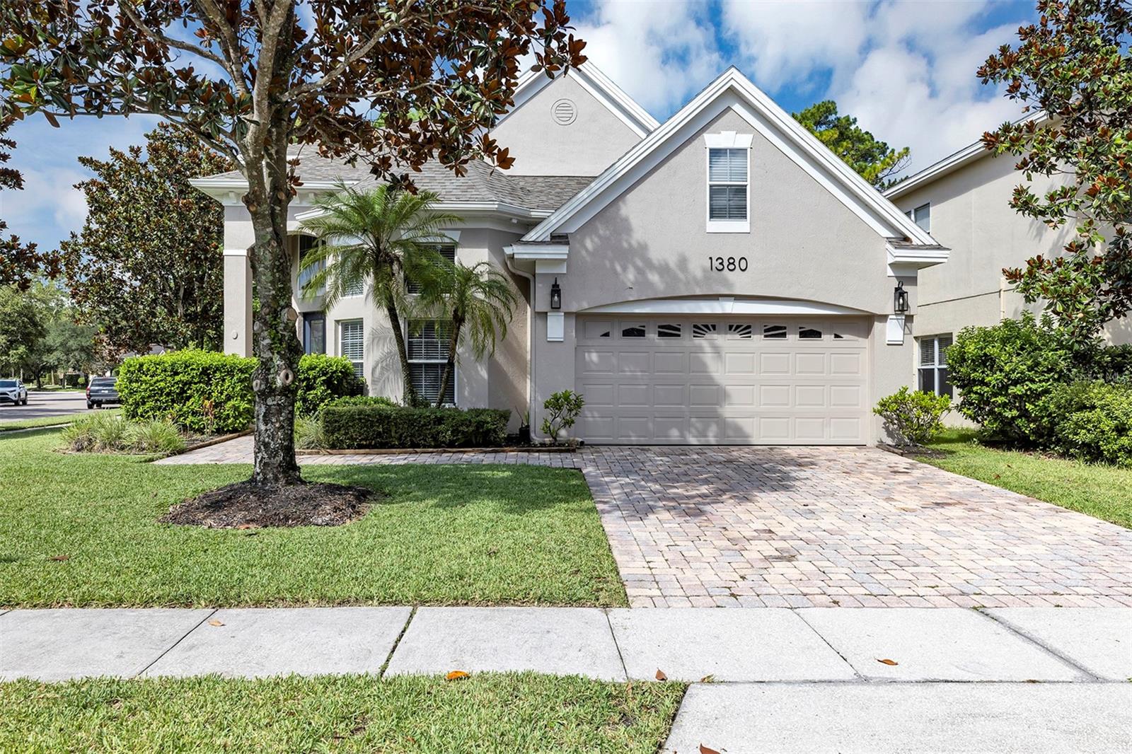 Welcome to this beautifully updated 3-bedroom, 2.5-bath home located in the desirable, guard-gated community of Woodland Lakes Preserve. Sitting proudly on a premium corner lot, this property offers a perfect blend of style, comfort, and convenience. Step inside to discover a bright and inviting floor plan featuring brand-new flooring (2022) and fresh interior and exterior paint. The contemporary design is highlighted by elegant iron stair rails and sleek quartz countertops in the kitchen, creating a space that's both modern and functional. Enjoy peace of mind with a new roof installed in 2022 and the added bonus of a walk-in attic for extra storage which is a rare and valuable feature. Situated just minutes from major shopping, dining, and entertainment areas, this home also offers easy access to major roads and highways, making daily commutes and weekend getaways a breeze. Don't miss this opportunity to own a move-in ready home in one of the area's most sought-after gated communities!