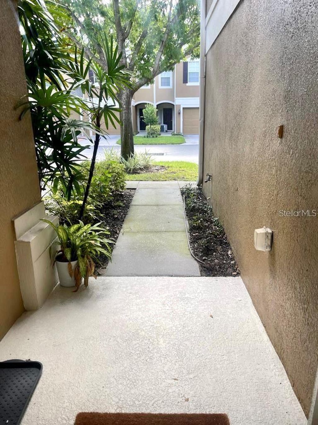 Photo of 2838 Villafuerte Point #104, Orlando, FL 32835 (MLS # O6354017)