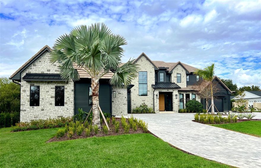 Introducing a one of a kind, breathtaking custom estate situated on the 15th fairway of the world-renowned Arnold Palmer’s Bay Hill Club & Lodge. Newly constructed with uncompromising craftsmanship and thoughtful design, this 5-bedroom, 8-bath masterpiece is a rare offering that blends luxury, comfort, and true resort style living. From the moment you step inside, the grand great room sets the tone with soaring ceilings and seamless integration into the chef inspired kitchen, featuring top-of-the-line Wolf and Sub-Zero appliances, custom cabinetry, stunning quartzite counters, and an expansive center island. A hidden prep kitchen with a walk-in pantry, additional oven, stove, dishwasher, and sink elevates the home’s functionality for both daily living and large-scale entertaining.

Every inch of this residence was designed for ease and indulgence, including two laundry rooms with one conveniently located upstairs near the three secondary bedrooms and another within the primary suite’s private mudroom. A second mudroom off the oversized 4-car garage (plus dedicated golf cart garage) adds even more convenience. The home also features an upstairs playroom/fitness room, a full movie theater with projector and tiered seating, and an elegant indoor bar area perfect for unwinding or hosting. The primary suite is a true sanctuary, boasting a luxurious bathroom with a private sauna, an enormous walk-in shower with seating, a dedicated makeup vanity, floating mirrors and a stunning walk-in closet room. Designer Kohler fixtures grace every bathroom throughout the home.

Indoor/outdoor living takes center stage with an expansive covered lanai, a fully equipped summer kitchen, multiple outdoor TV areas, and a spectacular resort-style pool featuring a spa and sun shelf, all overlooking unobstructed golf course views. This home delivers unparalleled sophistication in one of Orlando’s most iconic communities. Residents enjoy the exclusive Bay Hill lifestyle, including country club dining, tennis, a premier fitness center, and, of course, the legendary Arnold Palmer golf course. With a location just minutes from Restaurant Row, world-class shopping, and all major theme parks, this extraordinary custom home is truly without equal. More professional pictures coming soon.