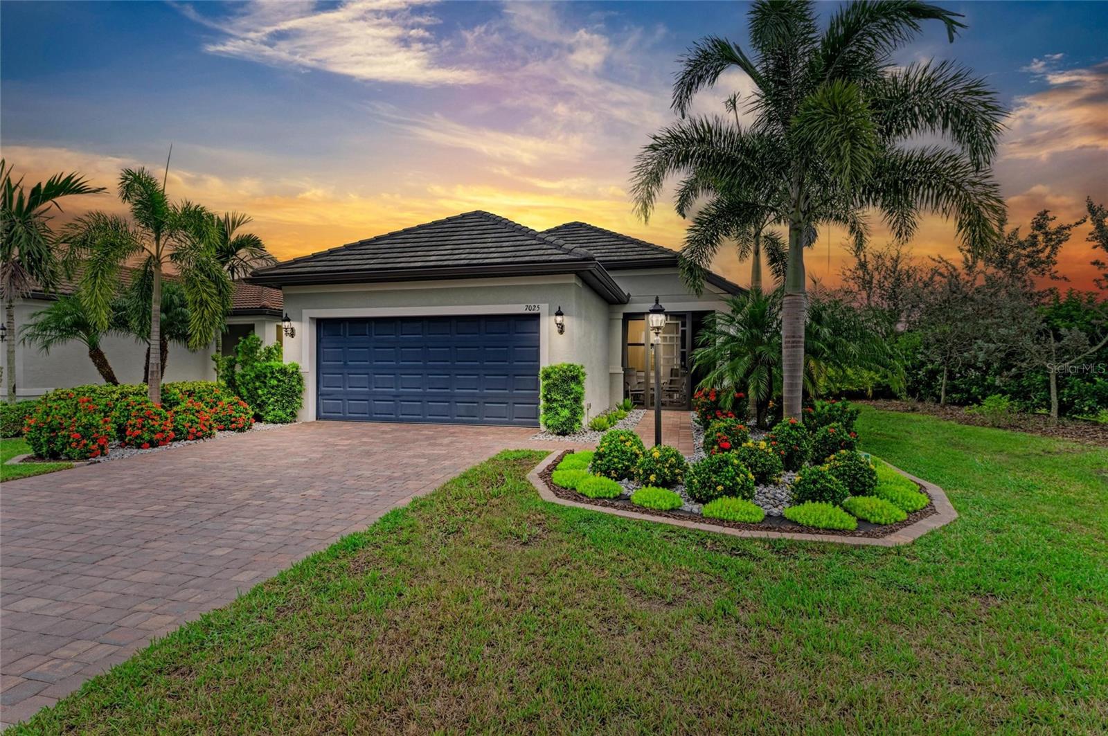 Welcome to this beautifully maintained Expanded Pulte Taft model in the highly desirable 55+ community of Del Webb at Lakewood Ranch. Thoughtfully designed for today’s lifestyle, this home features 2 bedrooms, 2 bathrooms, a sunroom, private office/den, and a 2-car garage, blending comfort, function, and style. Inside, the inviting open layout is filled with natural light and enhanced by HURRICANE-IMPACT WINDOWS for year-round peace of mind. The gourmet kitchen boasts 42” cabinetry, solid-surface counters, Whirlpool appliances, and a spacious center prep island—perfect for cooking and entertaining. The kitchen flows seamlessly into the living areas, creating an ideal gathering space. Step outside to the impressive 17’ x 30’ covered lanai, complete with a PANORAMIC NOSEEUM SCREENED ENCLOSURE framing tranquil pond views. Whether relaxing or entertaining, this outdoor oasis is a true highlight of the home. Additional features include a WHOLE-HOUSE 24 KW GENERAC GENERATOR, BRAND NEW HOT WATER HEATER, WHOLE-HOUSE WATER SOFTENER SYSTEM, TILE ROOF, BRICK LANDSCAPE CURBING, and a SCREENED IN FRONT ENTRY for added charm. Nestled on an EXTRA-WIDE LOT, this home reflects true pride in ownership. Within the maintenance-free gates of Del Webb, residents enjoy an unparalleled active lifestyle with two resort-style pools, a state-of-the-art fitness center, tennis, pickleball, bocce, an arts center, billiards room, internet café, on-site restaurant, and a full-time Social Director to insure a plethora of activities. All this, plus a prime location close to shopping, dining, golf, medical facilities, airports, and just 30 minutes from Gulf Coast beaches. Don’t wait, this house is a MUST SEE!
