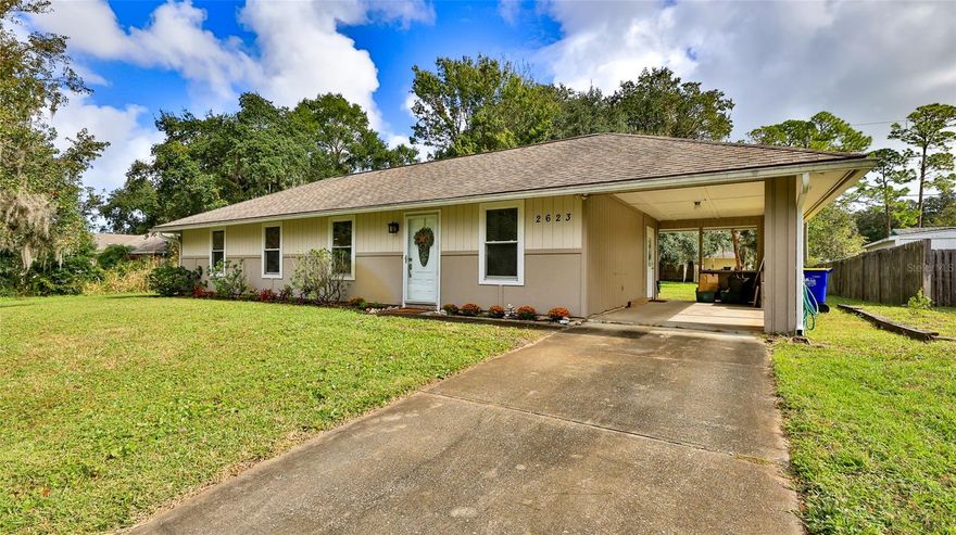 Move in Ready Doll House! Immaculate 3 br/1 bath w/carport is great for snowbirds, first time buyers or investors! The oversized laundry makes a great office area too. Enjoy family gatherings on your spacious enclosed back porch overlooking a serene back yard. No flooding issues! Call to see today.