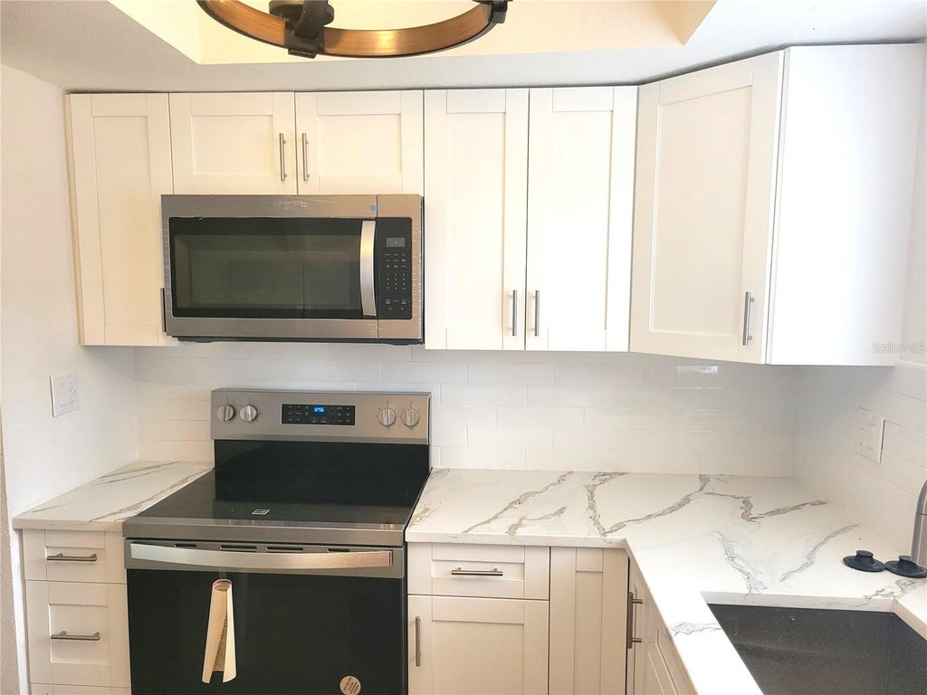 Photo of 1835 Maryland Avenue NE, St Petersburg, FL 33703 (MLS # TB8513615)