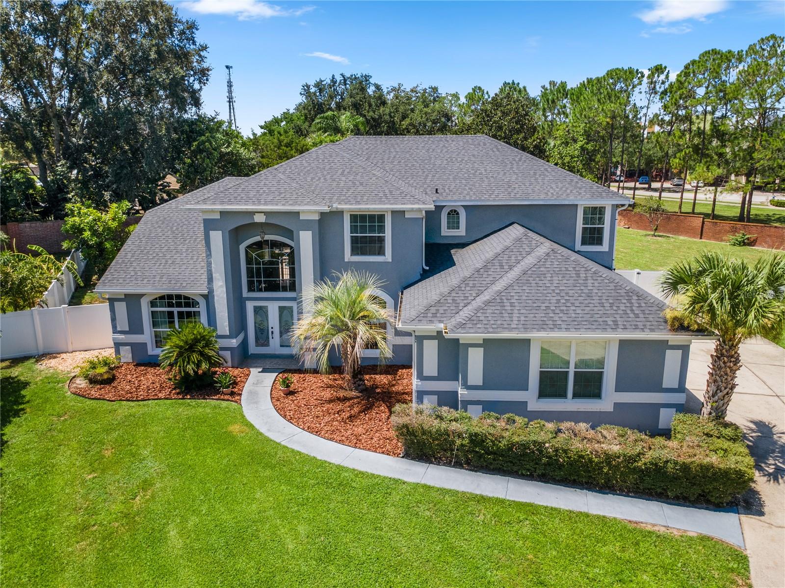 5 BEDROOM, 4 FULL BATH, 2 CAR OVERSIZED GARAGE POOL HOME IN ONE OF OVIEDO’S PREMIER COMMUNITIES: KINGSBRIDGE WEST! THE LOT IS ALMOST ½ ACRE! This gorgeous home sits on a cul-de-sac lot with an extra long driveway and side entry garage allowing for additional parking! 2025 ROOF, 2015 REPIPE, and recent EXTERIOR PAINT – all of these updates & improvements offer peace of mind to the new owner! This home’s floor plan design offers a formal living room and a separate dining room, great room, kitchen, breakfast area, and primary bedroom downstairs along with a full pool bath. 41’ x 8’ covered back porch overlooking a screened pool. Downstairs formal living room could make a great study or office. The pool deck was just painted (& caulked & sealed) for a fresh look! Follow this spacious design upstairs to 4 more bedrooms, 2 full bathrooms, and a cozy bonus room. You will love the low maintenance Italian Marazzi Wood looking tile throughout much of the downstairs including the primary bedroom! A hardwood staircase with an iron railing takes you upstairs to matching hardwood flooring in the bonus room. Medium gray upgraded carpet is in all the upstairs bedrooms and the great room for comfort. The kitchen cabinets have been professionally refreshed with white paint and beige granite countertops have been installed. ALL 4 BATHROOMS HAVE BEEN UPDATED WITH THE PRIMARY BATHROOM FEATURING A COMPLETE REMODEL INCLUDING FREESTANDING TUB, MARBLE SHOWER WALLS AND FLOORING, WOOD VANITY WITH MARBLE TOP, LIGHTING, MIRRORS, & TOILET! The updates in the upstairs bathrooms include tubs and shower tiles, floor tiles, vanities, lighting, and mirrors. The separate upstairs bathroom also has been completely remodeled. The huge fenced back yard has three avocado trees. This home is a short walk to Oviedo Blvd. and Oviedo on the Park with all of its shops, restaurants, parks, and annual events! And a short walk to the Oviedo Gym & Aquatic Center + the entrance to the Seminole Cross County Trail. Oviedo is known for its top-rated schools and convenient drive to beaches and tourist attractions. The University of Central Florida, Research Park, Seminole College Oviedo Campus, & Full Sail University (next to Costco), are within a 20-minute drive. Kingsbridge West has the Royalwood Park & a fishing dock on Long Lake & is next door to the beautiful campus for the Reformed Seminary. One hour drive or less to Cape Canaveral, New Smyrna Beach, Disney World, and Universal Studios. This is Florida living at its best! See provided feature sheet for a more detailed list of updates. SELLER IS OFFERING A BUYER CONCESSION FOR A PEBBLE-TEC POOL RESURFACE. *Since May 2024 Kingsbridge West has had non-lake front homes sell at $1,020.00 (3,372 ht. sq. ft.), at $876,000.00 (2,683 ht. sq. ft.), at $825,000.00 (2,795 ht. sq. ft.), at $825,000.00 (3,500 ht. sq ft.), & at $797,000.00 (2,632 ht. sq. ft.). 541 Green Park Court is comparable to these 5 recently sold KW homes that average selling at $293.00/square/foot & 541 Green Park Court is for sale at $280.00/square/foot.