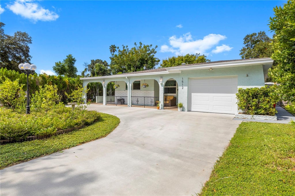 Photo of 1512 Country Lane W, Clearwater, FL 33759 (MLS # TB8549074)