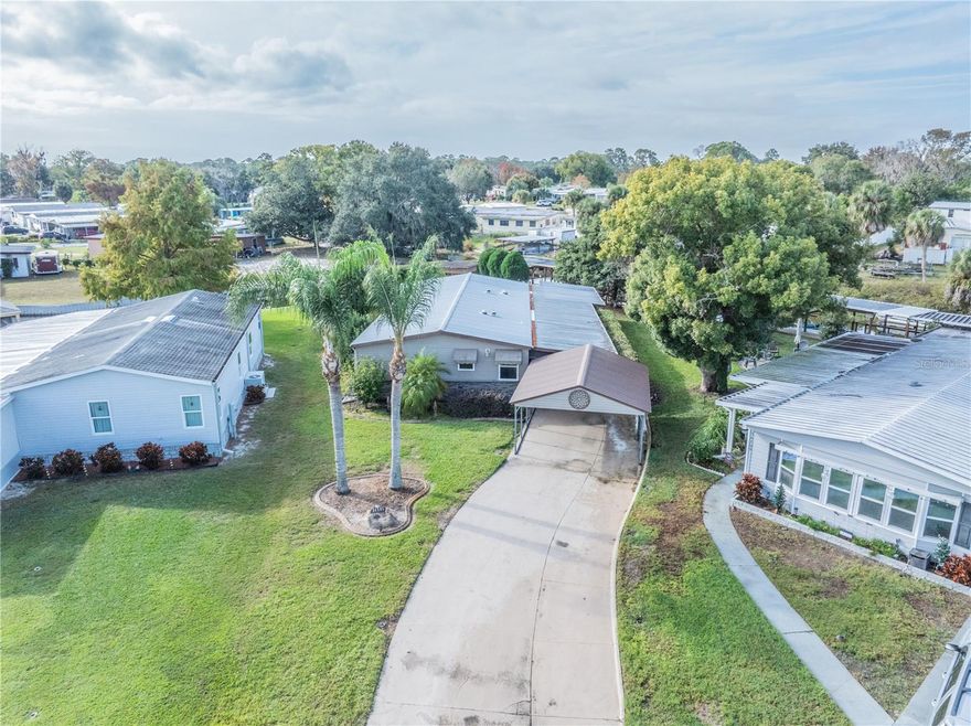 Stunning Renovated Canal-Front Home Just Steps from Lake Eustis & the Harris Chain of Lakes — A Fisherman’s Dream!
Welcome to this beautiful 3 bedroom, 2 bathroom canal-front home, perfectly positioned just a stone’s throw from Lake Eustis and the Harris Chain of Lakes. Situated on a corner cul-de-sac lot with double canal frontage, this property offers exceptional water access, peaceful views, and a lifestyle that truly embodies Florida living.
This home has been completely renovated down to the studs and showcases quality craftsmanship throughout. Enjoy beautiful textured drywall with knockdown ceilings, gorgeous laminate flooring in soft, beachy beige tones, and a bright, airy feel in every room. The thoughtfully designed layout includes a secondary bedroom large enough to comfortably accommodate a king-size bed, along with a spacious primary suite featuring a new tiled shower, updated vanity, and commode. Both bathrooms and the kitchen have been fully updated, offering modern finishes and style throughout.
Relax and take in the views from the screened lanai on the east side of the home, which offers lovely sights of Lake Eustis, or unwind in the backyard pergola space, intentionally designed for sitting or swinging while enjoying the tranquil water setting. This home is beautifully decorated, well cared for, and move-in ready and being offered FURNISHED. 
Additional highlights include an extra-large workshop/storage space, manicured landscaping, a large screened carport, plus an additional detached carport. Boaters and anglers will love the double boathouse and dock that wraps around the seawall, providing incredible access along both canals—truly a perfect fishing spot right in your own backyard.
This rare, double canal-front property offers unmatched waterfront living, exceptional renovations, and stunning views in a prime location near the Harris Chain of Lakes. Don’t miss the opportunity to own this one-of-a-kind home!