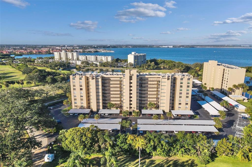 PRICE REDUCTION!! Seller offering an attractive One-time Credit at closing to offset closing costs or COA fees... This RARELY available OVERSIZED Corner Unit 2 Bedroom 2 Bathroom floorplan located in Village 2 of Cove Cay is now on the market! A true gem located in this highly sought-after waterfront gated community situated along Tampa Bay and the Cove Cay 18-hole golf course. The unit boasts ceramic tile throughout the entire floorplan. The light and bright kitchen has lots of cabinet space, a closet pantry and a separate dining area! The spacious living/family room gives you plenty of space to entertain, with large sliding door to access to the screened in porch sitting area. The huge master bedroom has enough room to add a sitting area and has a large window overlooking the lush, landscaped grounds. The master bathroom has a walk-in closet, spacious separate vanity area with double sinks and fantastic lighting. The guest bedroom and bathroom are well appointed for the comfort of your family and friends. The private laundry room is right across the hall and has lots of room for extra storage. The community features a beautiful USGA rated 18-hole championship length golf course, full-service marina, and 24/7 guardhouse. Village 2 features a clubhouse with community pool and hot tub, fitness center, library, pool table, fireplace, shuffleboard court, gas grill, and so much more. Includes internet, cable TV, water, sewer, building and grounds maintenance and also has an on-site property manager. Near gulf beaches, great dining and shopping, airports and museums. New water heater in 2022. Included is one covered parking space and this is one of two buildings that allows a small pet.