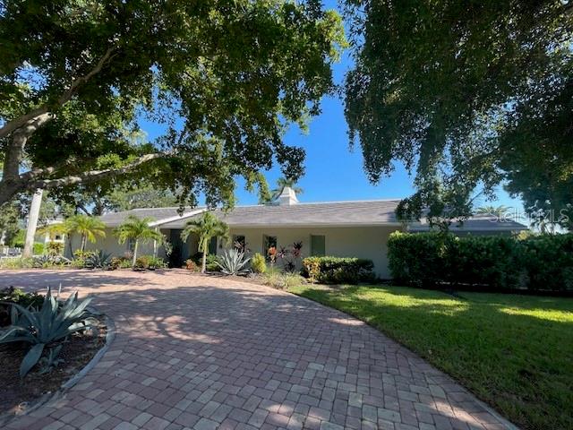If you are looking for luxurious living while indulging in the most breathtaking green scenery, then this stunning 4-bedroom, 4-bathroom waterfront home in Sarasota is the perfect place for you. With its 147 feet of waterfront, vaulted ceilings, and panoramic views of the water, this home is the perfect place to relax and enjoy the Florida sunshine. The kitchen has been updated with fusion granite counters and stainless steel appliances, and the living room is open and airy, with plenty of windows to let in the natural light. The master bedroom has an ensuite bathroom, a spacious walk in and there is also a large screened-in patio with a comfortable daybed. The home is located in the desirable Bird Key neighborhood, which is known for its beautiful waterfront homes and its proximity to amenities such as restaurants, shops, and parks. It is also a short drive to St. Armands Circle, Lido Beach, the cultural scene in Sarasota, and a variety of cuisines in stylish restaurants. But what really sets this home apart is its stunning views of the surrounding green scenery. From the living room, you can see the lush trees and plants that line the waterfront This home is the perfect place to escape the hustle and bustle of city life and relax in the lap of luxury, all while surrounded by the most beautiful natural scenery. Available for seasonal rent through April 2024 for $19,500. Contact us today to learn more and book your reservation!