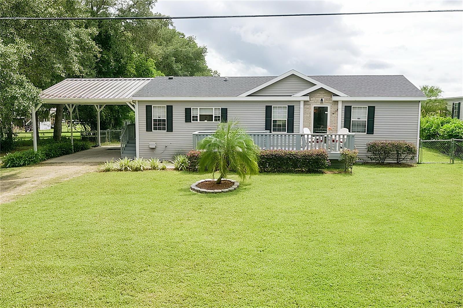 One or more photo(s) has been virtually staged. Escape to peaceful country living with this rare rural homestead, offering serene morning and evening views surrounded by natural beauty.
This property features two homes, making it ideal for family living, extended family, guests, or even rental income.
The primary home welcomes you with a cozy front porch—perfect for enjoying quiet evenings with a glass of lemonade. Inside, you’ll find a spacious double-wide home with 3 bedrooms, 2 full bathrooms, and walk-in closets in every room. An open floor plan offers a family room, large kitchen with eat-in space, and an indoor laundry closet. With no carpet, crown molding, and durable vinyl flooring throughout, upkeep is simple. The primary suite is a true retreat with double sinks, a garden tub, and a separate shower—a layout designed for comfort and convenience. Plus, the new shingle roof (2024, Marion County permit issued) provides peace of mind for years to come.
Adding even more value, the secondary home (currently being completed and ready before closing) includes a full bathroom with shower, mini kitchen, washer/dryer hookup, and vinyl flooring. This space is perfect for in-laws, guests, or as a rental opportunity.
Outdoors, the property is fenced around the back yard and offers versatile spaces for both relaxation and practicality. A storage shed keeps equipment organized, while the enclosed screened porch sets the mood for peaceful afternoons or evenings of reading, relaxing, or entertaining. There’s even a full RV hookup for added flexibility.
Blending rural charm, functional amenities, and room to grow, this dual-home property is perfect for anyone seeking a true homestead lifestyle. Conveniently located near Ocala, it’s an excellent choice for a seasonal retreat, investment property, or forever home.