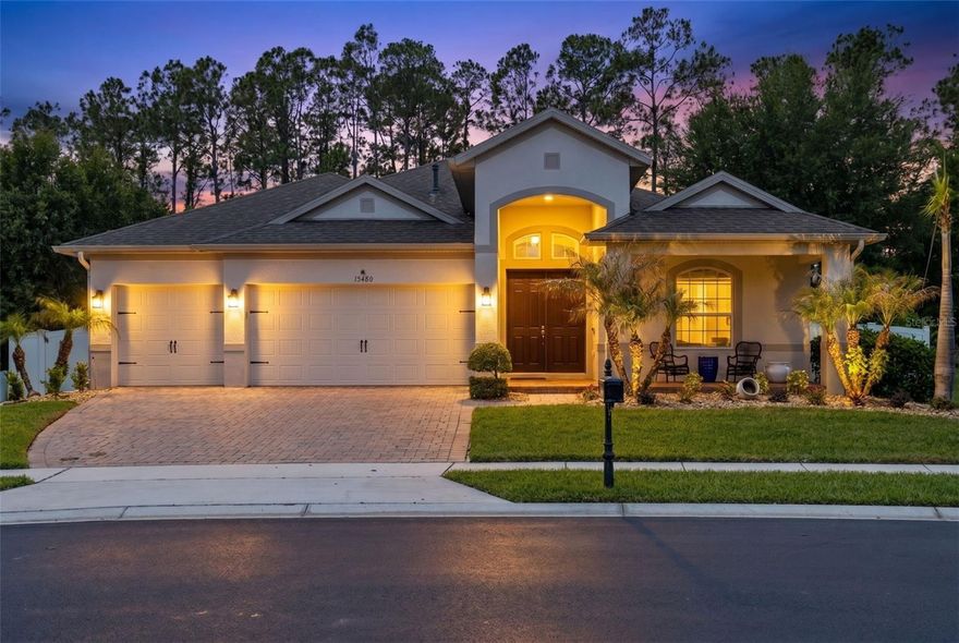 One or more photo(s) have been virtually staged. Set within one of Winter Garden’s most sought-after communities, 15480 Sandfield Loop presents a thoughtfully updated residence defined by clean, modern finishes, soaring interior volume, and a seamless connection to outdoor living. A welcoming front elevation and expansive paver driveway introduce the home with presence, leading to a light-filled interior where elevated ceiling heights and continuous wood-look tile flooring create an immediate sense of openness and cohesion. The main living area is anchored by volume and natural light, with large sliding glass doors framing views of the covered lanai and screened pool beyond. The kitchen has been completely redesigned with all-new cabinetry and features granite countertops and a functional island layout that offers both everyday practicality and an ideal setting for gathering. Pendant lighting and stainless steel appliances complete the space, maintaining a clean, timeless aesthetic. All secondary bathrooms have been fully updated with modern finishes, including sleek vanities, updated fixtures, and sliding glass door showers, delivering a polished, move-in ready experience throughout. The primary suite offers a spacious layout with the opportunity to further personalize, creating a private retreat tailored to your vision. Outdoor living is where this home truly shines. The covered lanai extends seamlessly from the interior, overlooking a screened-in pool and spa designed for year-round enjoyment. Beyond, the fully fenced backyard opens to a rare sense of privacy, backing to a rural settlement with no direct rear neighbors, creating a setting that feels both open and secluded. Positioned on a corner homesite along a gently curved street, the property benefits from added spacing, enhanced curb presence, and a more open feel than typical interior lots. Situated just minutes from shopping, dining, and major roadways, this home combines thoughtful interior updates, strong architectural volume, and a highly livable indoor-outdoor layout, an increasingly rare offering at this price point.