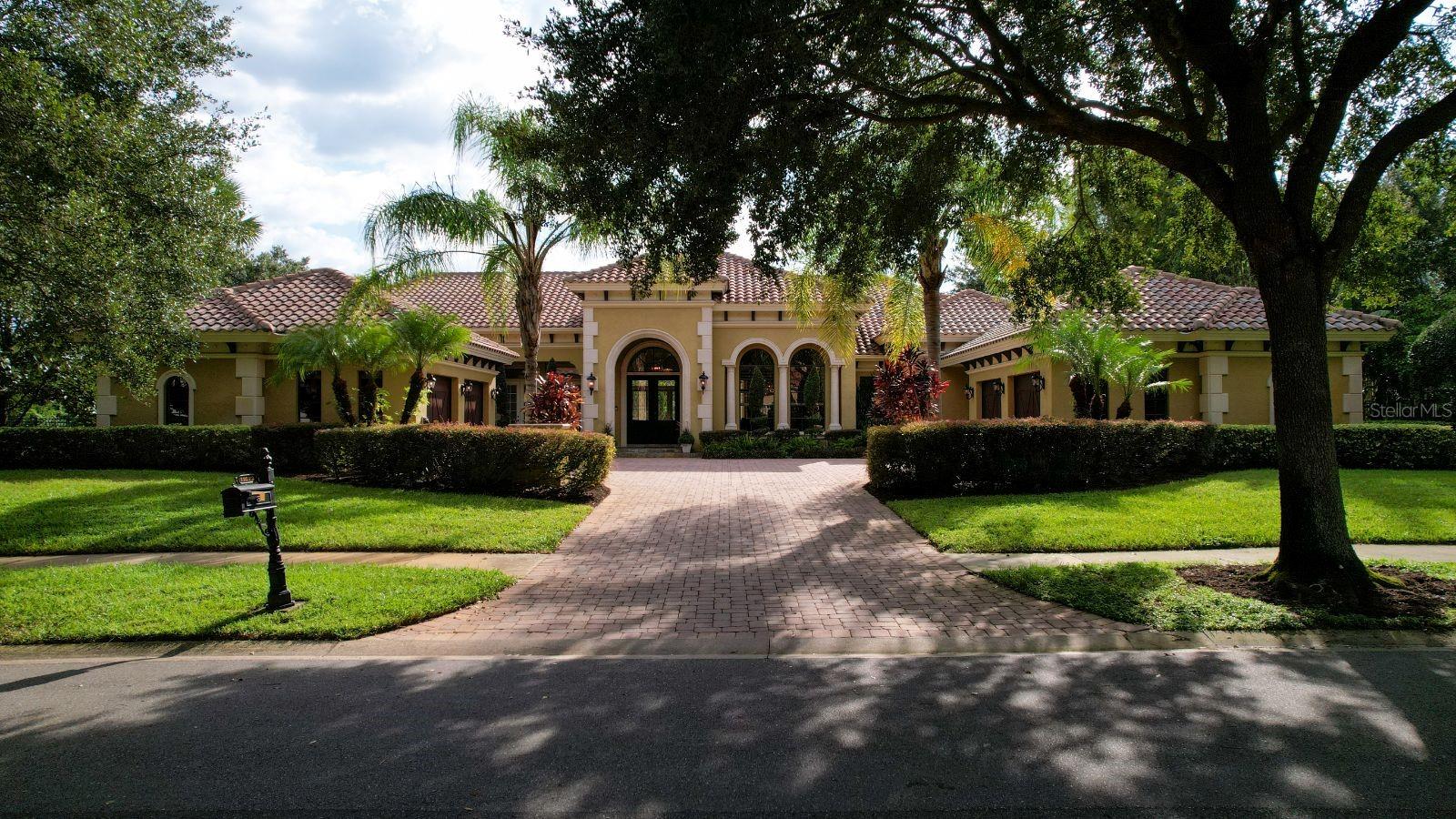 Prepare to be impressed with this expansive 6,176 sq ft of living space all on one level! The Allesandro model was built by custom builder Dave Konkel and it was a finalist for the distinguished Aurora Award. This estate home features old world styling with elegance, featuring hand painted beams and ceilings, stone floors, freshly painted walls and Ventian plaster accents. The kitchen is spacious and features Busby cabinetry, Sub-Zero and Wolf appliances and much more.
The owner's suite is the ultimate space that includes a grand bedroom exercise room or baby nursery and a private courtyard off the elegant owner's bath. Outside of the primary owner's suite is a grand and formal office with a two-sided fireplace over looking the pool and spa.
If you enjoy outdoor entertaining look no further, as this home has a beautiful summer kitchen, a massive covered lanai and a huge pool deck. It also has a large fenced lawn for family and pets to play. Additionally, this grand home has a large game room or theater that overlooks the pool and summer kitchen.
Featuring 5 bedrooms, 4 1/2 baths and a 4 car garage. Plus a large laundry room with a sink and built-ins. This special home won't last long. Call for your showing and private tour in this exclusive 24 hour guard gated community!