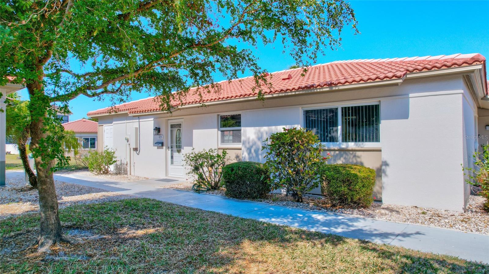 Discover your slice of paradise in this beautifully renovated villa nestled in the much sought after community of Vista Hermosa on Siesta Key. Step inside to find a completely transformed living space featuring new luxury vinyl flooring throughout. The kitchen boasts a recent renovation with elegant quartz countertops and gleaming stainless steel appliances, including a new dishwasher, stovetop, and microwave. Comfort meets efficiency with a newly installed A/C system, ensuring year-round climate control. This maintenance-free community offers a heated swimming pool, renovated clubhouse w/kitchen, grilling areas, and an assigned covered parking space. Located just a few minutes from the world-renowned Siesta Beach, known for its powdery sand and crystal-clear Gulf waters, this 2 bedroom, 2 bath villa offers the perfect balance of relaxation and recreation. The vibrant Siesta Key Village is also nearby, providing endless opportunities for dining, shopping, and entertainment. Enjoy the convenience of living close to Stickney Pointe bridge where you can venture off the island in minutes to visit Downtown Sarasota, St. Armands's Circle and Longboat Key! This turnkey residence presents an excellent opportunity for those looking to establish roots in one of Southwest Florida's most desirable coastal communities. Whether as a permanent residence, seasonal retreat or investment opportunity, this villa's recent updates and prime location make it an ideal choice. Don't miss the chance to make this renovated coastal gem your own!