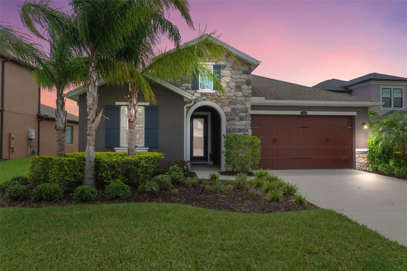 Welcome to this stunning single-story WATERFRONT home featuring 3 bedrooms + office + 3 full bathrooms in the highly sought-after Estancia at Wiregrass Ranch. Built by CalAtlantic, this home offers extensive builder and owner upgrades that elevate both style and functionality. Designed with both comfort and sophistication in mind, the open layout offers airy spaces filled with natural light and crown moulding . Situated on a cul-de-sac road, enjoy serene pond views from the expansive covered lanai, perfect for outdoor relaxation and entertaining. The upgraded chef’s kitchen overlooks the family room and dining area, showcasing max-tier cabinetry, quartz countertops, a farm sink, soft-close drawers and doors, Whirlpool smart oven/microwave, NEW stainless steel dishwasher, a mini refrigerator with quartz cabinetry surround, plus a water filtration system—all powered by gas. Additional highlights include wood-look tile flooring, upgraded front entry door with keypad lock, Ring camera, upgraded glass pantry and office doors, alarm system, finished laundry room with washer and dryer included, and a pull-down ladder in the garage for attic access. The home is also equipped with plumbing for an outdoor kitchen and a car charger for hybrid vehicles. Bedrooms feature StainMaster upgraded carpets, and the owner’s suite offers spa-inspired finishes. Fully fenced yard perfect for pets and privacy. With thoughtful details like designer lighting, smart features, and timeless finishes throughout, this home is truly move-in ready. Located in the gated Cortona section, residents enjoy world-class amenities including a grand clubhouse, resort-style pool with water slide, tennis and pickleball courts, dog parks, walking trails, and more—all just minutes from top-rated schools, shopping, dining, and major highways. Schedule your private showing today!