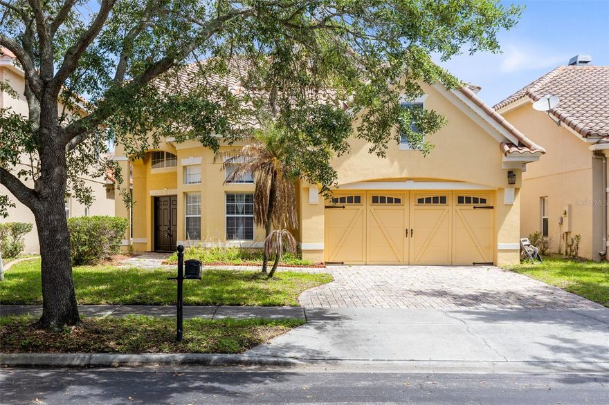 Welcome to 6841 Dolce Street, an elegant and spacious residence located within the gated community of Toscana in the heart of Orlando’s highly desirable Dr. Phillips area. Designed with comfort, flexibility, and everyday living in mind, this 3-bedroom, 2.5-bath home offers an impressive open layout with generous room sizes, soaring ceilings, and multiple flexible spaces that make the floor plan truly stand out. The main level features the primary living areas along with a spacious first-floor primary suite, complete with double-door entry, a luxurious en-suite bath, and a large walk-in closet. The kitchen is well-appointed with updated 42-inch cabinetry, granite countertops, stainless steel appliances, and a breakfast bar overlooking the great room, creating an easy flow for both daily living and entertaining. Just off the kitchen, a large breakfast nook adds even more functional space. The family room showcases dramatic two-story cathedral ceilings with an open balcony overlook from the second-floor loft area, adding volume, natural light, and architectural character. Also located on the first floor is a dedicated office with French doors, offering an ideal space for working from home, studying, or creating a quiet flex room. Upstairs, the home continues to impress with two additional bedrooms, a media room or second office, and a bonus room with walk-in storage, giving the home exceptional versatility beyond the standard bedroom count. Enjoy Florida living from the screened lanai, perfect for morning coffee, relaxing evenings, or casual outdoor dining. Additional features include an EV charger, tile roof, attached 2-car garage, cathedral ceilings, crown molding, stone counters, walk-in closets, window treatments, and a thoughtfully designed layout with 2,787 heated square feet and 3,306 total square feet. Toscana offers a secure gated setting in one of Orlando’s most convenient locations. Just minutes from Dr. Phillips’ famed Restaurant Row, Universal Orlando, SeaWorld, Walt Disney World, premier golf courses, The Mall at Millenia, Premium Outlets, Whole Foods, Trader Joe’s, major highways, downtown Orlando, and Orlando International Airport, this home places you close to some of Central Florida’s best dining, shopping, entertainment, and everyday conveniences. With its standout floor plan, first-floor primary suite, flexible office and bonus spaces, screened lanai, and unbeatable Dr. Phillips location, this Toscana home offers the space, lifestyle, and convenience buyers are looking for.