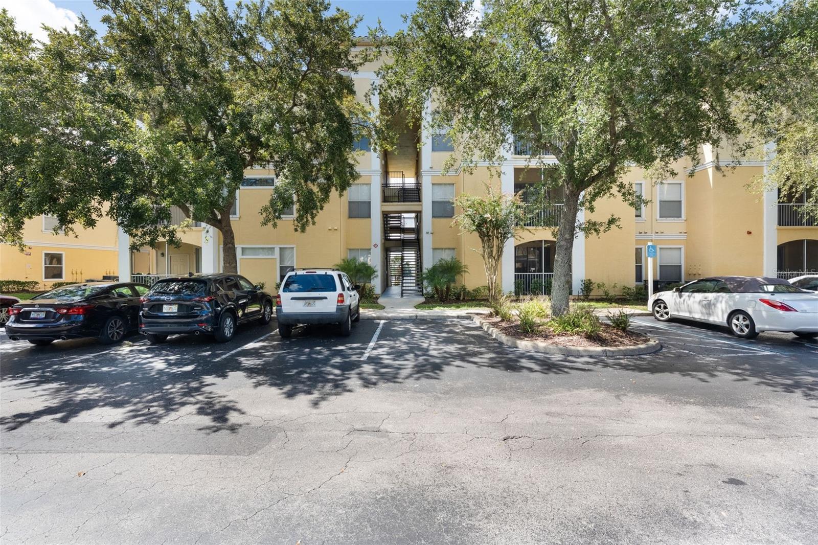 Stunning first-floor 2-bedroom, 2-bathroom condo with lake view in Maitland! Fully renovated and upgraded, this unit also includes a dedicated carport space. Located in the beautiful, gated community of Visconti West, this open floor plan features a modern kitchen seamlessly connected to the great room, split bedrooms, an interior laundry closet, and a screened-in patio overlooking Lake Shadow. Enjoy an abundance of natural light, stylish shutters, new ceiling fans, and wood-look porcelain plank tile flooring throughout. Additional upgrades include all new stainless-steel appliances, granite countertops, new soft close cabinets, a new AC unit, a new water heater, updated bathroom tub tile, new toilets, new lighting, and fresh paint. This like-new condo is ideally situated with access to fantastic community amenities, including a community pool, walking trail, clubhouse, picnic areas, playground and more! Move-in ready and waiting for you!