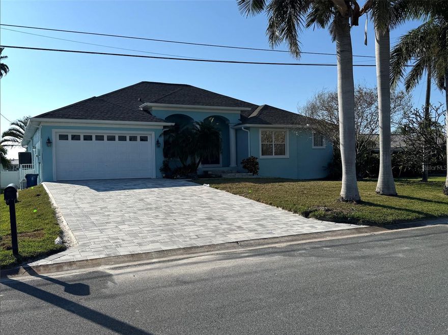 ***MEETS FLOOD CODE- 9.5' ELEVATION WITH ACCESSIBLITY FEATURES***  Welcome to your coastal sanctuary, sitting high atop this gorgeous lot and unaffected by flood waters from recent hurricanes!

This is where modern luxury meets the natural beauty of the the Gulf Coast.  Completely remodeled from top to bottom, this stunning waterfront home blends clean contemporary design with the warmth and comfort of a true Gulf Coast getaway.

Step inside to soaring ceilings, expansive windows, and an open-concept layout. Every detail has been thoughtfully curated—sleek finishes, high-end fixtures, and a seamless indoor–outdoor flow perfect for both relaxation and entertaining.

Wake up each morning to serene bay views, enjoy gentle breezes from your private outdoor living spaces, and end your evenings watching the sun melt into the water. With direct access from the bay to the Gulf, it’s an ideal haven for boating, fishing, and soaking in everything coastal living has to offer.

Whether you’re seeking a tranquil retreat or a show-stopping waterfront home to share with family and friends, this modern masterpiece invites you to slow down, unwind, and make every day feel like a vacation.
