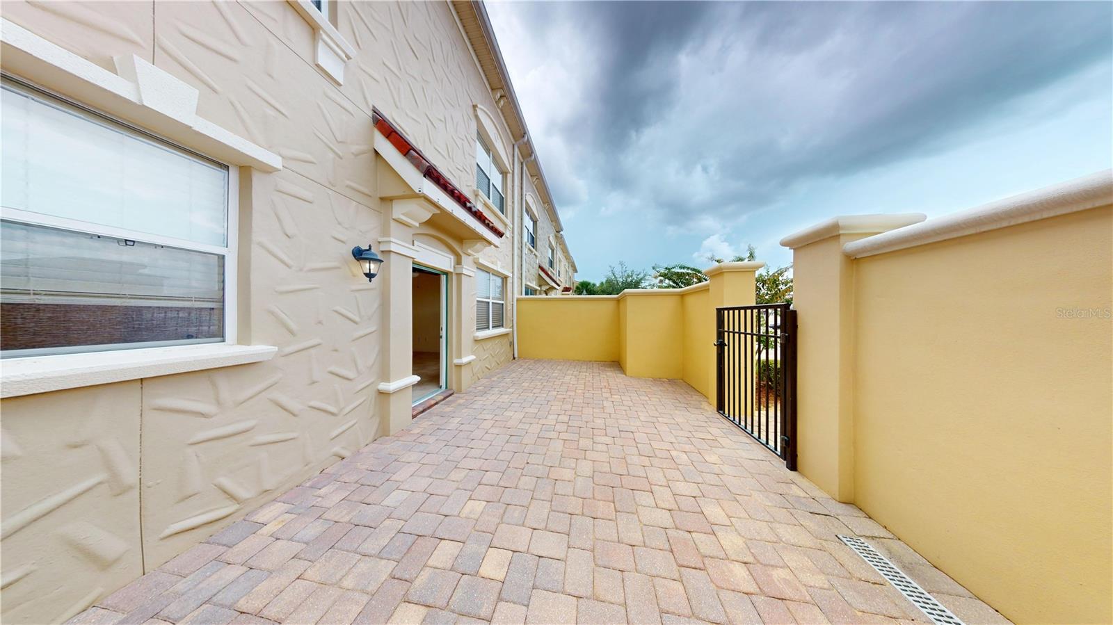 Enjoy the splendor of this beautiful 4/3 Townhome Villa located in Waterstone in Davenport. Here you'll appreciate maintenance-free living at its finest. Large open floor plan, spacious kitchen, ceiling fans, recessed lighting, cool tile, laminate and fresh carpet. Washer & Dryer included! Just a quick stroll to community pool and fitness center. You'll love this place!