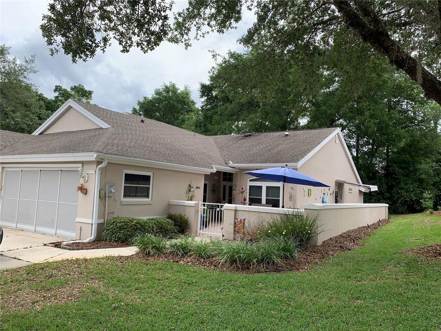 Professional photos coming soon - GORGEOUS expanded Chesapeake Villa located in Oak Run, Ocala FL, a premier 55+ community!  3 bed, 2 bath, 2 car garage, roof replaced 2017, A/C replaced 2017 under service maintenance contract every 6 months, all new windows 2024, interior paint 2024, your own private hot tub installed with retractable awning 2024.  Total kitchen remodel with newer stainless steal appliances, extra cabinets, marble backsplash, granite counter tops, breakfast area, new lighting, new fans, 2 solar tubs giving additional light.  The back of living room opens into the lanai with the view of private backyard.  The monthly service fee includes yearly power washing and every 5th year repainted exterior of Villa, lawn care, trimming and water.  Also includes the use of all amenities except golf, which includes 6 swimming pools, 5 hot tubs, onsite library, 2 workout rooms, billiards room, ceramic/craft room, shuffleboard, pickle ball, horse shoes, bocce ball and tennis courts, over 100 clubs to join.  There is so much to do and not enough time to do it all!!  This can be your new life!!  Book your private showing today before its too late.