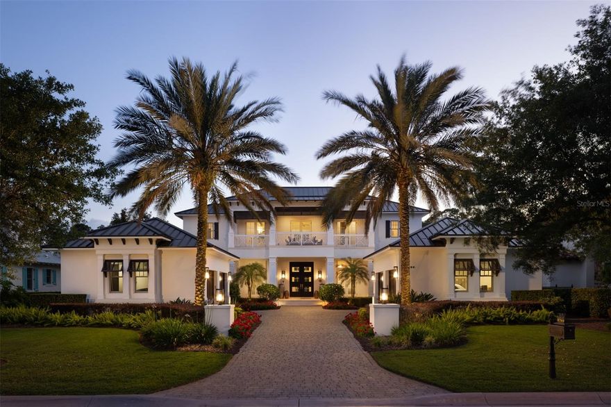 Welcome to 9744 Vista Falls, located in the Silverbrook neighborhood at the exclusive Golden Oak community at the Walt Disney World Resort. This stunning home was built by Derrick Builders in 2015. The home offers five bedrooms with four en-suite bathrooms, a powder bathroom and an outside pool bathroom. Spanning over 5,200 square feet, the transitional contemporary interior has been recently elevated with a complete interior refresh. Every detail has been captured in the construction and design of this home. The coastal elevation welcomes you through the double entry into the grand foyer with french doors overlooking the grand pool, conservation and creek views. Past the formal living is the newly added coffee bar, complete with a hammered copper sink. Into the chef’s kitchen, you’re offered every amenity, including Wolfe + Sub-Zero appliances with cabinet-level finishes, 6-burner gas range, a hidden pantry, a double island and expansive counter space. The statement piece of the kitchen is the custom range hood tying in the colors of the family room which flows seamlessly from the kitchen and opens to soaring ceilings. The family room was freshly re-designed with a custom floor-to-ceiling marble fireplace and built-ins around the fireplace. The space is completely captivated by large windows and sliding glass doors, giving you expansive views of the pool and conservation. The right wing of the home offers a downstairs guest suite with en-suite. This wing is also complete with an appointed laundry room and detailed powder bathroom. On the left wing of the home, the floor plan offers another downstairs guest room, currently being used as an office. The remaining space in the left wing encompasses a sitting space leading to the primary suite, and the primary en-suite. The sitting space was originally designed as an office, and can functionally double as such. The primary spaces are complete with Mother of Pearl stone on the fireplace and in the en-suite, silk wallpaper, silk drapery and custom fixtures. The en-suite offers a spa-like experience with a soaking tub and an incredible shower. The upstairs offers two additional guest bedrooms, both complete with en-suites and unparalleled design finishes. The upstairs also boasts a loft, a front balcony and the rear balcony overlooking the rear views unlike any other. The home offers a four-car garage, a rarity for Golden Oak. The coveted community of Golden Oak offers an exquisite living experience, unlike any other in the world. This gated community features magnificent homes and world-class amenities. Some of the amenities include: access to Golden Oak's private clubhouse, Summerhouse, with a resort-style pool area, restaurant, bar, Golden Oak concierge service, and so much more. Don’t miss the opportunity to call this incredible home your own, call today to schedule a private tour. The property is being offered fully furnished, inquire to learn more about the furniture package details.