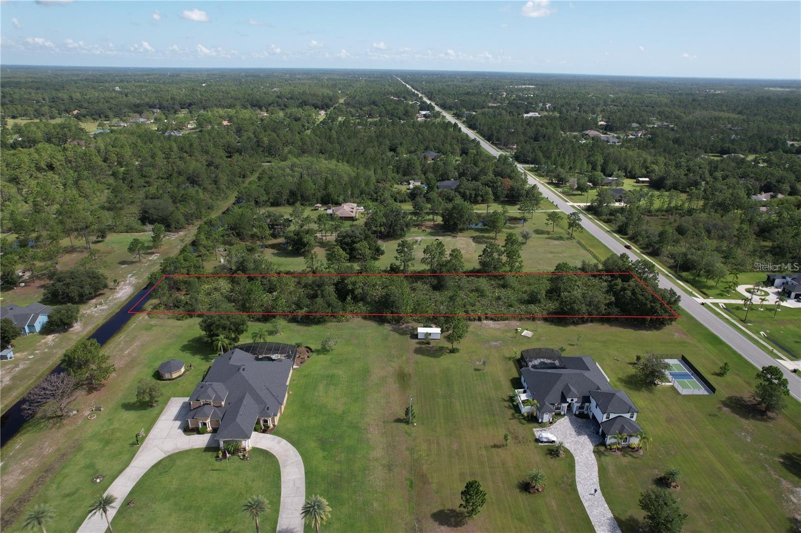 Discover a rare opportunity to own over 2 acres of land in this highly coveted area of East Orlando area. Nestled in the sought-after community of Wedgefield, this expansive parcel offers the ideal setting to build your custom dream home. Enjoy the perfect blend of space, privacy, and convenience—all within reach of city amenities. Minutes from Downtown Orlando, UCF and the Space Coast. Don’t miss out—contact us today for more information!