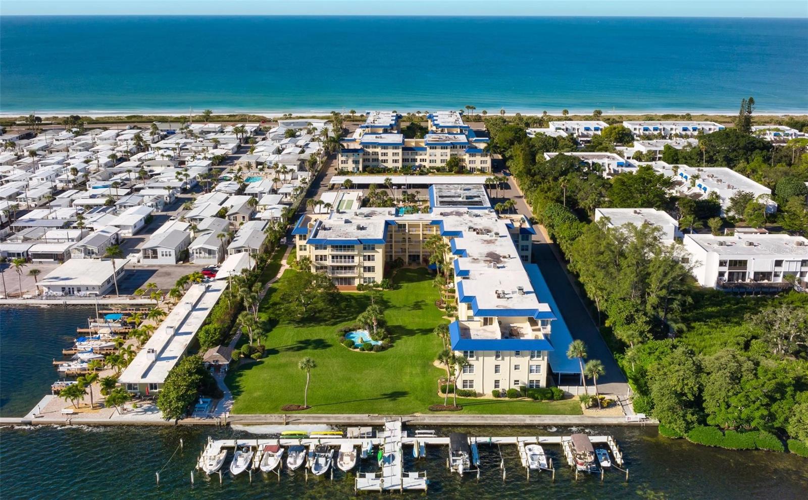 1-bed, 1-bath paradise on the stunning Longboat Key, where every amenity you could dream of is at your fingertips! Nestled in the fabulous Beach Harbor Club, this beach-to-bay community is packed with perks. Enjoy deeded beach access and the community’s private beach area, complete with grills, showers, and comfy beach chairs and lounges. Swim in the heated pool, paddle around on community kayaks, socialize with neighbors in the expansive clubhouse, and get your daily work out in the fitness center! This turnkey unit boasts beautiful bay views right outside the front door, floods of natural light, a spacious walk-in closet, and a covered parking space. Ideally located in the middle of the key, with easy access to Publix, the chic St Armands Circle, Downtown Sarasota, and the charming Anna Maria Island. Your dream getaway awaits! ***Some amenities are still closed/damaged from the 2024 hurricanes.***