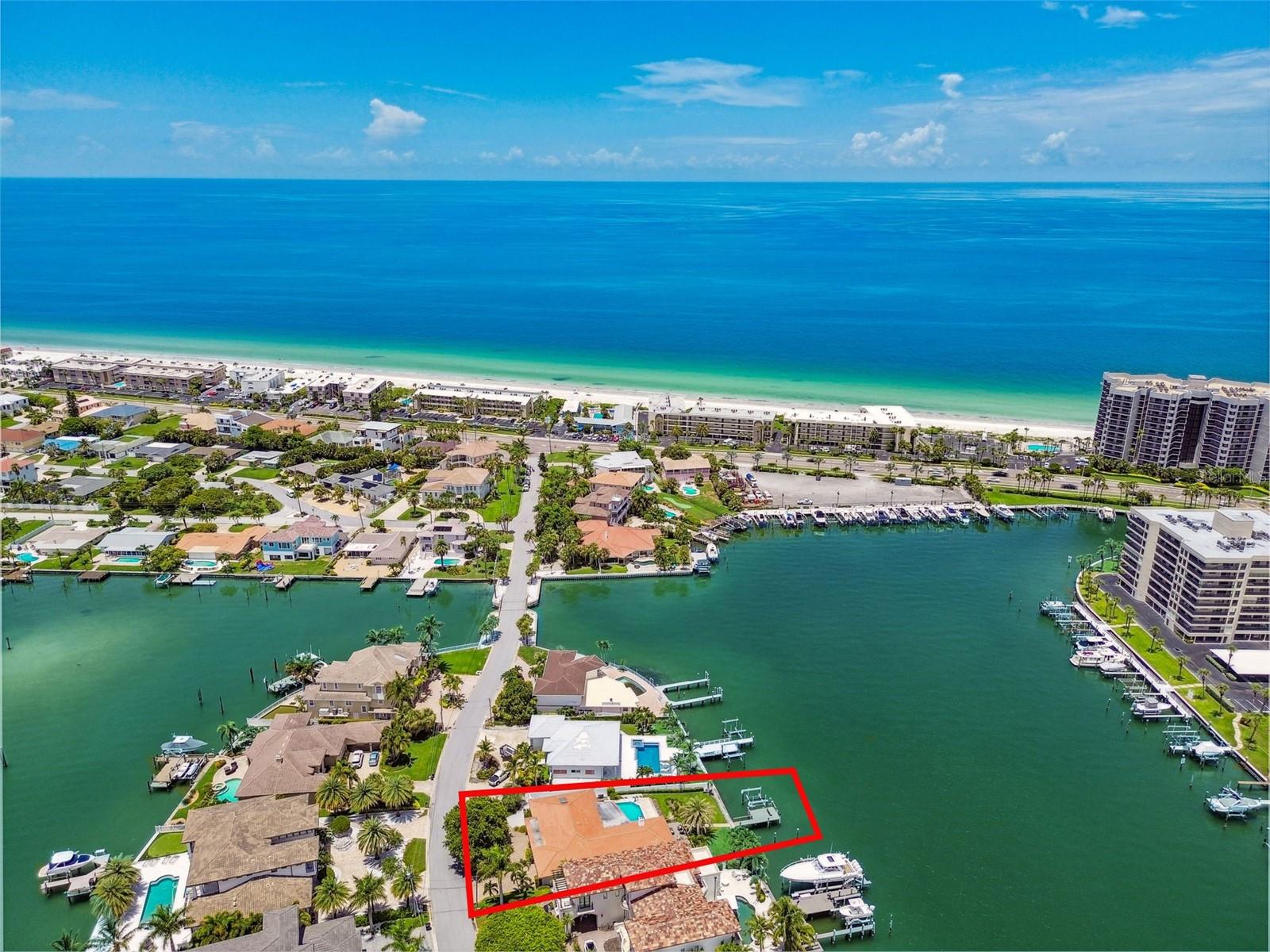 UNAFFECTED BY FLOODING - Waterfront Oasis Steps from the Beach - Just a block from the private pedestrian BEACH Access on Harrison Ave, this 4-bedroom, 3-bathroom residence, located in the coveted city of Belleair Beach, offers bright and airy coastal living, cozy fireplace, large eat-in kitchen, granite countertops, high-end appliances, 3 autonomous sleeping quarters featuring spacious bedrooms. Oversized primary suite comes with private access to the pool area, his/hers walk-in closets and an en-suite bathroom. Speedy access to the Gulf from the deep-water Intracoastal waterway. 69 feet of water frontage, 12K lbs boat lift, NEW dock and decking. The house is equipped with an energy-efficient water softener system as well as a whole-home GENERATOR. Home has received significant RECENT UPDATES (new floors, pool resurfacing, new outdoor Weber built-in gas grill, hurricane rated garage door, plantation shutters, garage floor epoxy, new pool heater & pump, new interior exterior painting just to name a few).