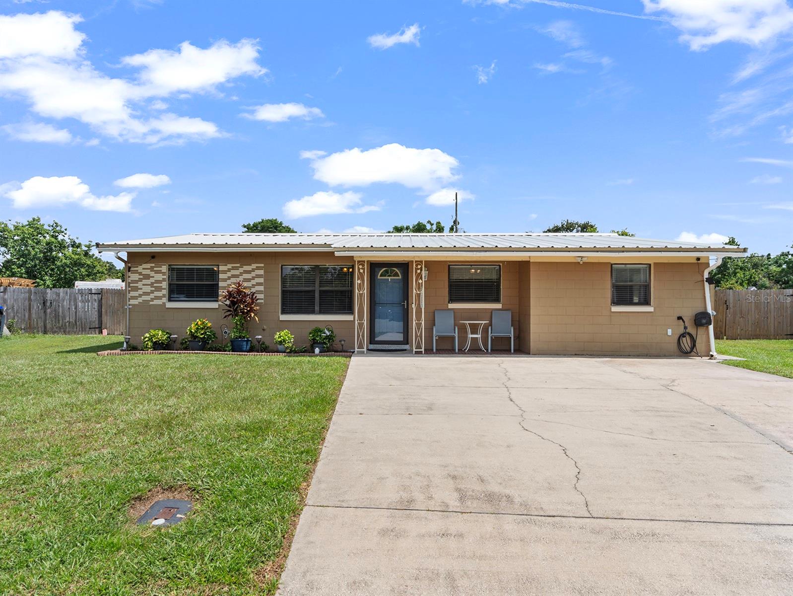 One or more photo(s) has been virtually staged. ONE-THIRD ACRE, BACKYARD OASIS, on a quiet CUL-DE-SAC, with no HOA! This updated mid-century beauty has everything you’re looking for with a location that makes enjoying the City Beautiful a breeze! TOUR THE HOUSE WITH THE VIRTUAL TOUR and VIDEO WALK THROUGH LINKS. Step in to the open floorplan, and the first thing that will catch your attention is the space you’ll have in the updated kitchen for storage, prep, and serving. Ample cabinetry and a large closet pantry with barn doors, stainless steel appliances, and an apron sink are just a few of the highlights! The large island will become a gathering place for a nosh and connecting with friends and family. Just off the kitchen, the rear family room addition provides space for relaxing on your comfy furniture and leads out to the covered patio and tiki bar. Prepare yourself for weekend barbeques and family gatherings that will be remembered for years! The fenced backyard also features a salt-water pool and jacuzzi, and plenty of space for storage sheds, or even your boat and camper, complete with an installed RV hook-up. Back inside, the primary suite features an ensuite bathroom with beautifully tiled-shower, as well as a large closet space with custom built-ins. Two additional bedrooms are found across the house, and an additional bathroom. The current owners have lovingly cared for the house over the past 10 years and have not only updated many of the cosmetic features you’ll see, but have also updated the AC, roof, on-demand water heater, plumbing, electrical (to also include an exterior generator hook-up for storm preparation AND an Electric Vehicle charger), as well as some smart-home features. With the great shopping and restaurants of the Millenia area just around the corner, the location can’t be beat! In about 20 minutes in any direction you can be to Downtown Orlando, Universal, Disney, or the Orlando International Airport, with easy access to I-4, the Turnpike, and popular thoroughfares. Don’t miss your opportunity for this house to become your new home!