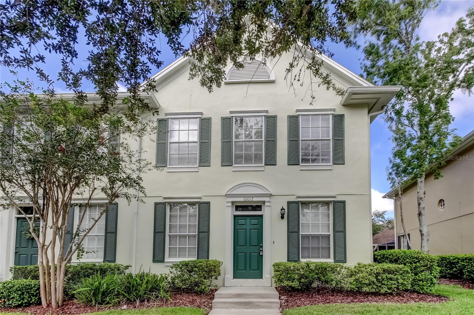 Fantastic WEST PARK VILLAGE in WESTCHASE! This end unit townhome is in immaculate condition with luxury vinyl flooring (no carpet!). Light, neutral colors and plenty of natural light. The kitchen features wood cabinets, granite countertops, stainless steel appliances and a brand new washer and dryer in the walk in pantry/laundry space. Sliding glass doors from the family room lead out to a screened patio - ideal for relaxing, entertaining and BBQ grills are permitted. New ceiling fans throughout. The detached garage can be accessed by the rear alley. Upstairs find all three bedrooms, each with vaulted ceilings. Enjoy the West Park Village lifestyle, complete with vibrant restaurants, shops and gathering spots. Westchase offers terrific amenities; golf, swimming pools, tennis, pickleball, parks, sports fields and more! Available now and move in ready! Clean and inviting! One year lease MINIMUM - longer terms also available.