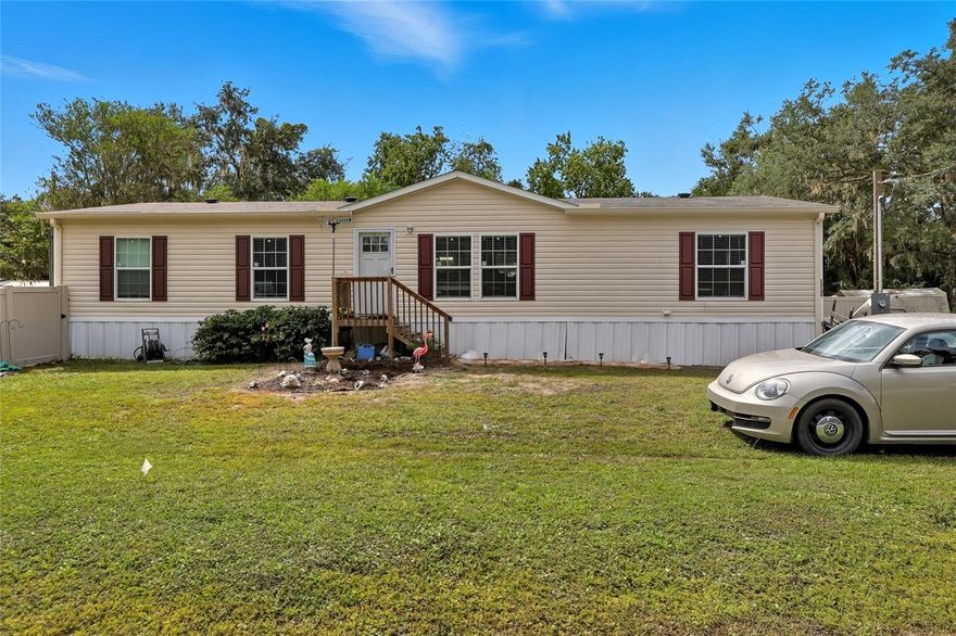 Welcome to 39508 Bay Ave, Zephyrhills – where fresh modern living meets cozy country charm! Built in 2024, this gorgeous, manufactured home offers 3 spacious bedrooms, 2 full baths, PLUS an office that could easily be converted into a 4th bedroom – perfect for growing households, guests, or a flex space that fits your lifestyle. Inside, you’ll love the bright open floor plan, modern finishes, and plenty of natural light. With just over 1600 square feet of living space there is plenty of room. The kitchen island is HUGE making entertaining
a snap, a nicely sized pantry, and stainless-steel appliances. Closet space a plenty in all the rooms. Outside, the fully fenced backyard gives you room to garden, play, or relax in total privacy. It’s the ideal mix of country feel and convenience, with downtown Zephyrhills just minutes away for shopping, dining, and everyday needs. Also, an easy commute to Plant City, Wesley Chapel, Lakeland and other surrounding areas. If you’ve been searching for a home that gives you space to spread out while keeping you close to all the action, this one
checks every box!