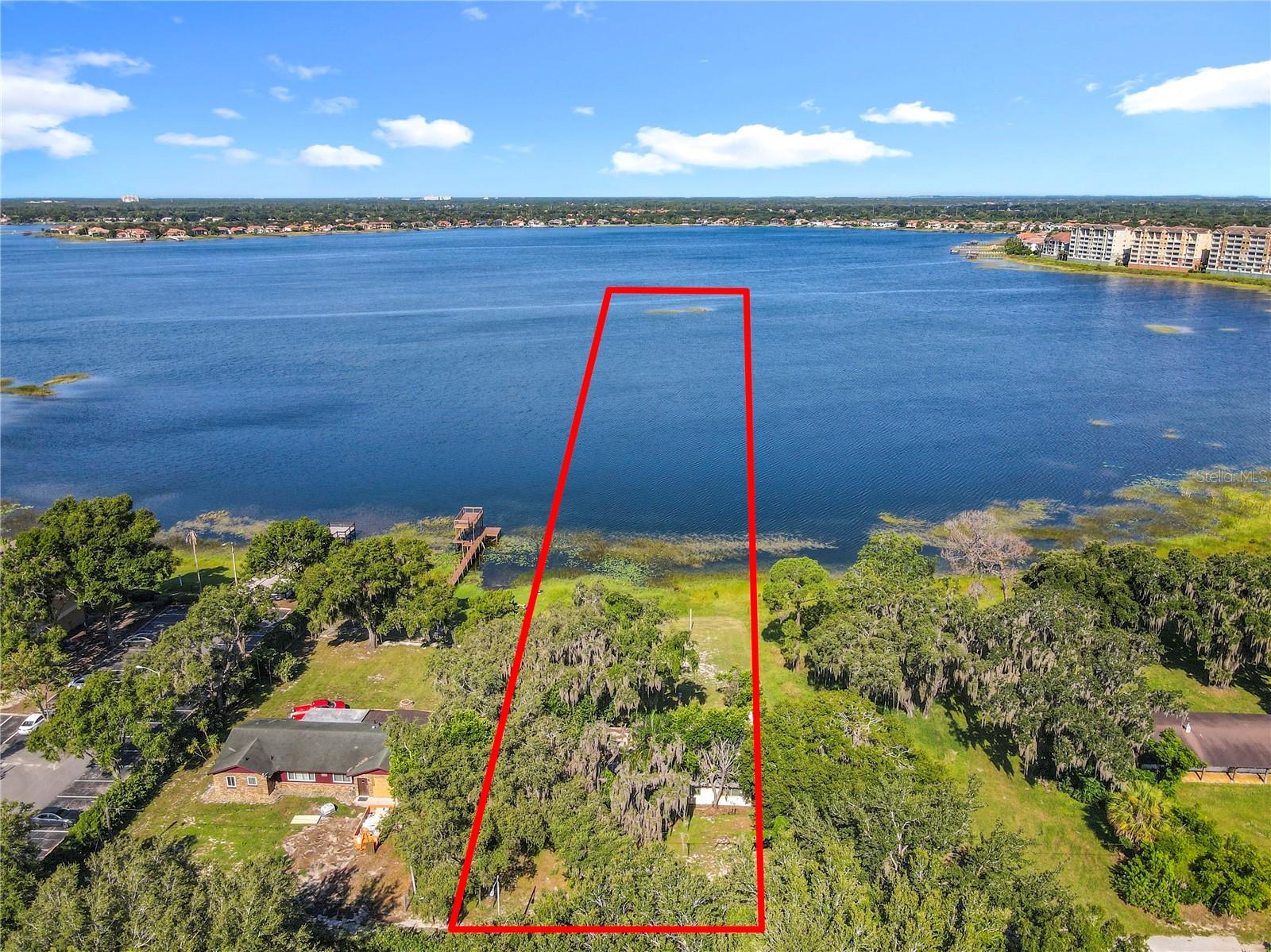 Rare Old Florida Lakefront Estate – Skiable Chain of Lakes
Step back in time and experience the rare charm of Old Florida with this incredible lakefront property on a private, skiable chain of lakes in Orlando. Set on approximately 2.25 acres with the ability to add a private boat dock, this home offers the freedom to enjoy water skiing, boating, fishing, and all your favorite lake activities just steps from your back door.
Built in the 1950s, the 3-bedroom, 2-bath home radiates vintage character that’s hard to find today and provides the perfect canvas for updates, renovations, or even a full expansion. Surrounded by mature trees and natural beauty, the property is tucked behind two secure gates for exceptional privacy. The exclusive community has only about eight homesites, making large parcels like this virtually impossible to find in such a prime location.
Enjoy the magic of living just minutes from world-class theme parks, Michelin-star dining, luxury shopping, and vibrant entertainment. In the evenings, relax in your backyard as you take in nightly fireworks from Disney and other nearby attractions. Orlando International Airport is just 30 minutes away, and the beaches are roughly an hour’s drive.
With well and septic utilities, you’ll enjoy the benefit of no monthly water or sewer bills. Plus, the lake’s near-private status—no public dock access—means you can soak in the peace, freedom, and fun of true waterfront living.
This is more than a property—it’s a once-in-a-lifetime opportunity to own a piece of Orlando’s rich lakefront history in a location that truly has it all.
Schedule your private showing today!!
