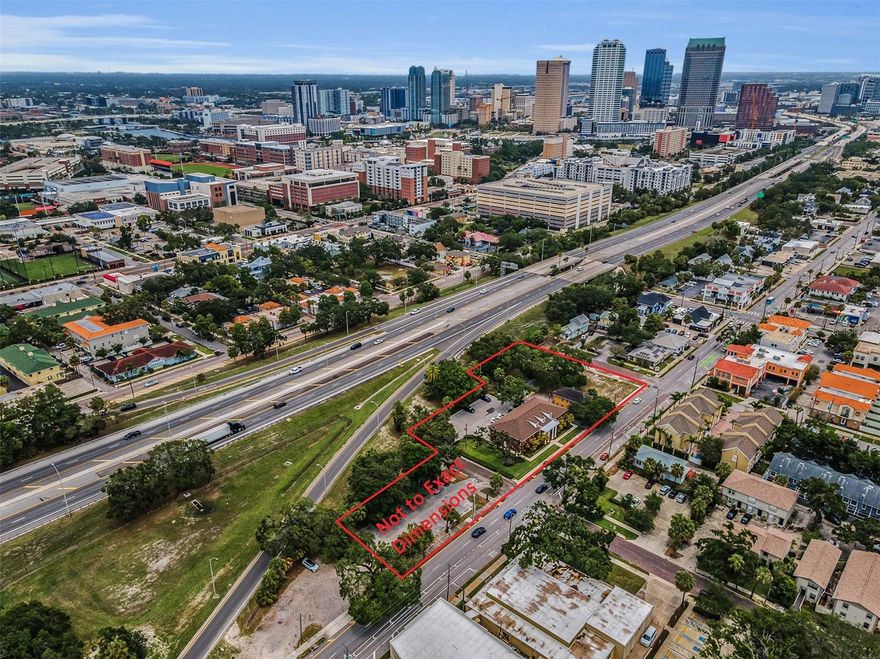 This listing encompasses the prestigious Alexander Building, a paved parking lot and 4 additional lots that total 1.27+ prime acres near the Selmon Crosstown Expressway and close to Hyde Park. This commercial property enjoys a remarkable 500 ft (mol) of highly visible street frontage (when factoring in vacated rights of way). The Alexander is a large 8100+ sqft multi-use professional office building. Built in 1985, the classic red brick exterior with three architectural dormers and white columns graces the front elevation with sophistication and elegance. An impressive, 17ft-high entry lobby/reception area delivers a refined and notable first impression. Boasting 16 offices (including 2 office suites with private rest rooms), 4 executive assistant support areas, 3 file rooms, 3 copy/storage rooms, two lunch rooms, 3 exceptional conference rooms (with each conference room comfortably seating 8 people), 4 multi-stall rest rooms and a dedicated server/network communications room, this facility can handle the workload of two substantial law practices or a multi-specialty physician clinic. The central location (just seconds from the Selmon Crosstown Expressway) enjoys immediate access to Hyde Park and superior convenience to Tampa's central business district and South Tampa. With direct views from the Crosstown and outstanding linear street frontage, this uncommon property presents outstanding advertising signage opportunities. Not to be outdone, the valuable surface parking is extraordinary. An asphalt-paved parking lot behind the building has 20 spaces with concrete curbing and concrete wheel stops, and your adjacent parcel provides an additional 26 paved parking spaces. Totaling 0.55 acres, four unimproved/underimproved lots present a tremendous complementary development opportunity to the Alexander building itself; zoned CG with a CMU-35 future land use, the properties in total offer the prospect of a significant yet cost effective legal, medical or business complex near the downtown business district and Hyde Park itself. Given the high-quality location and unique size, this is a rare opportunity that is aggressively priced for immediate sale!