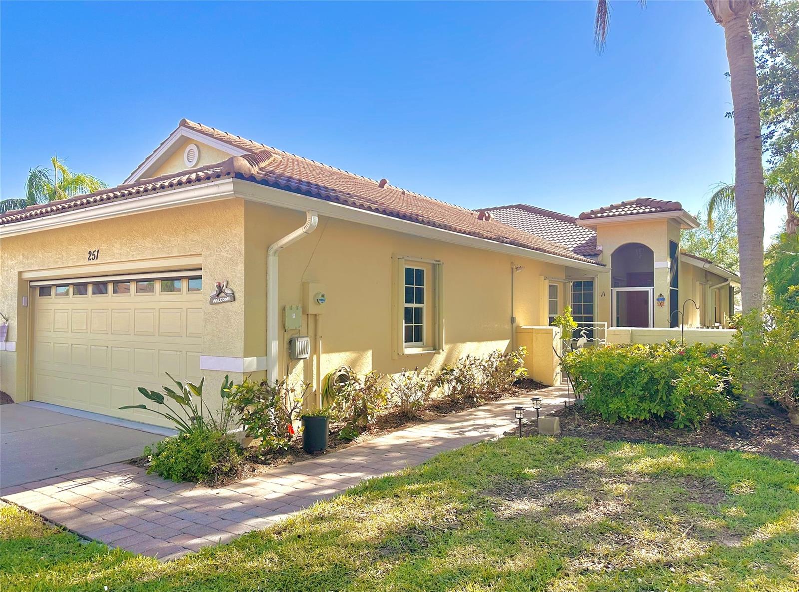 ANNUAL Rental, Turnkey Furnished (new Kitchen & flooring). Need a Rental while your home is being built...PRIVACY is what you'll experience with this END UNIT VILLA, which is located at the end of the pond with lush tropical landscape, surrounding the quaint brick paver patio. Relax and enjoy the lovely view of the pond or entertain with this spacious hideaway. There is new vinyl plank living room flooring in the dining room, and den/study and new bedroom carpet. The Second bedroom has a Murphy bed with built in shelving and a view of the front courtyard. The Den/Study is just off the living room, allowing extra convenience for that extra needed space for an office or separate entertaining with a skylight and a foldout sofa. The new large kitchen is bright with a vaulted ceiling. There is an eat in breakfast nook and pantry with shelving. The garage has an extra refrigerator/ freezer, with a one car parking space available for your use. The small clubhouse and pool are located within the block. This home has it all including close to shopping, Venice Beach, golf, tennis, parks, croquet, and the new police station. Call for your showing today!